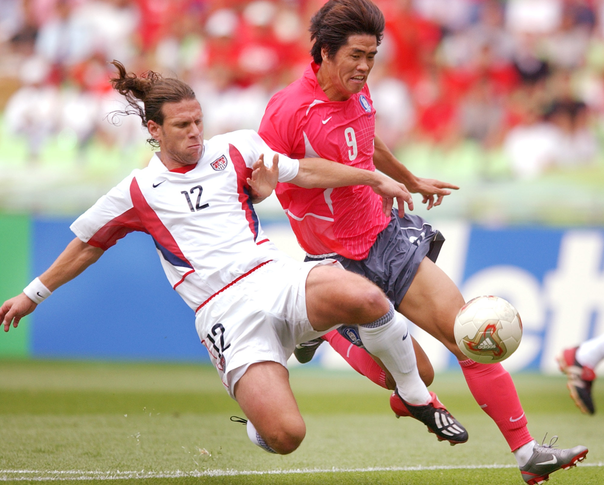 FILE - U.S. player Jeff Agoos challenges South Korea's Ki Hyeon Seol, right, during a 2002 World Cup Group D soccer match in Daegu, South Korea, June 10, 2002.