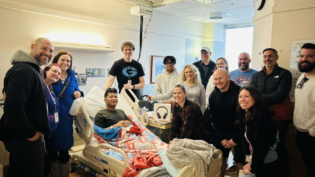Teachers at Granger High School visit Sha Reh in the hospital. The 18-year-old was seriously injured by a gunshot wound in a shooting that killed the rest of his immediate family in West Valley City.