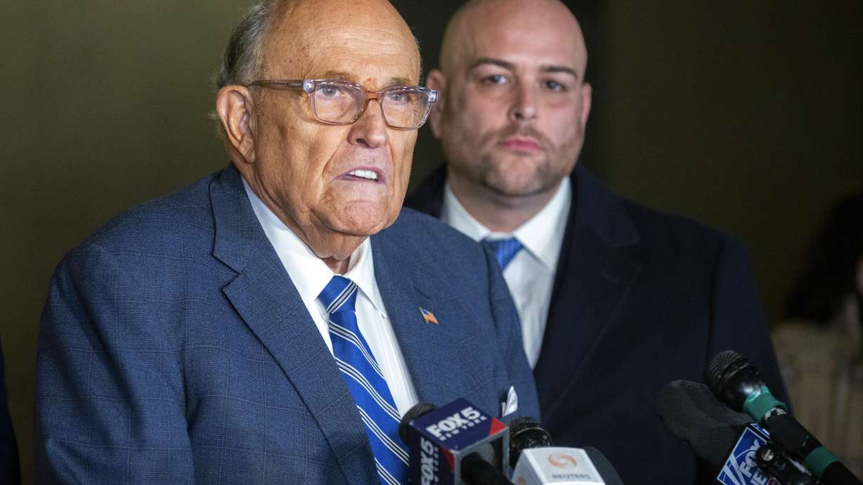 Rudy Giuliani speaks to the media outside Manhattan federal court in New York after testifying in a contempt hearing, Friday, Jan. 3, 2025.