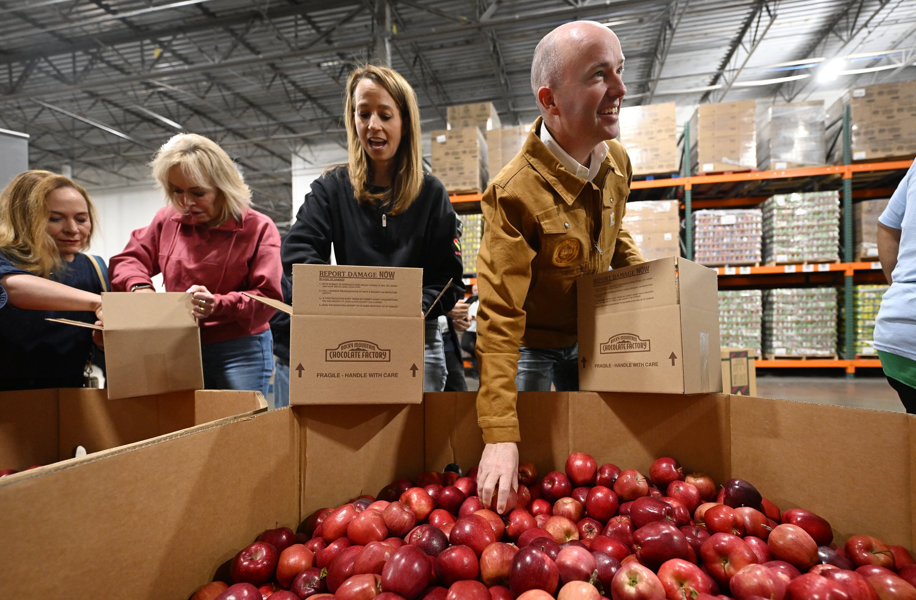 Gov. Cox, other Utah leaders serve at food bank and talk about upcoming legislative session