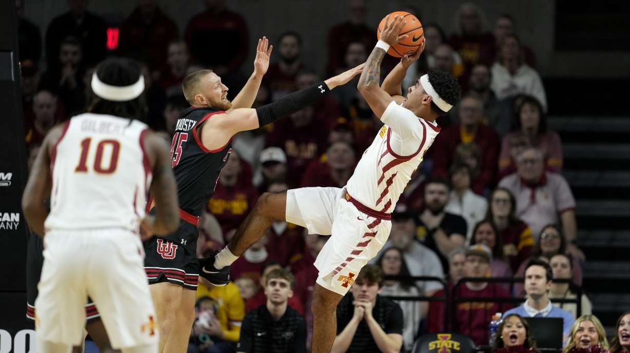 Iowa State guard Tamin Lipsey shoos over Utah guard Mason Madsen during the first half of an NCAA college basketball game, Tuesday, Jan. 7, 2025, in Ames, Iowa.