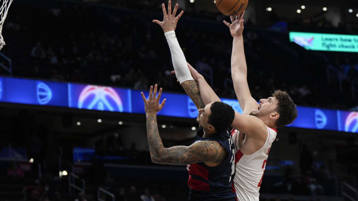 Houston Rockets center Alperen Sengun (28) goes up against Washington Wizards forward Kyle Kuzma (33) during the first half of an NBA basketball game Tuesday, Jan. 7, 2025, in Washington.
