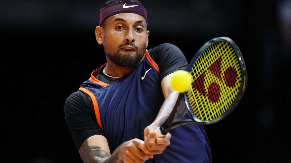 FILE - Nick Kyrgios of Eagles returns the ball to Grigor Dimitrov of Falcons during a match of Day 3 of the World Tennis League at Coca-Cola Arena in Dubai, United Arab Emirates, on Dec. 21, 2022.