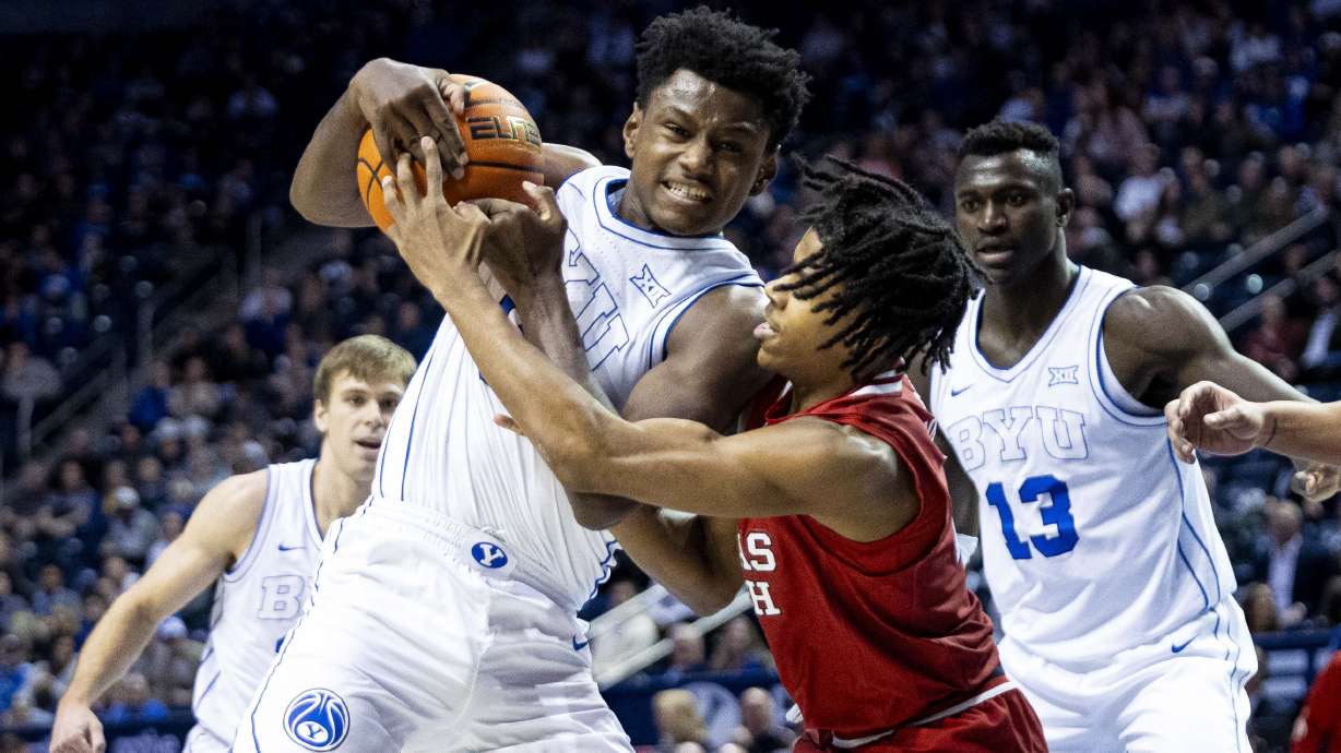 BYU Cougars forward Kanon Catchings (6) and Texas Tech Red Raiders guard Christian Anderson (4) compete for possession of the ball during an NCAA men’s basketball game held at the Marriott Center in Provo on Tuesday, Jan. 7, 2025.