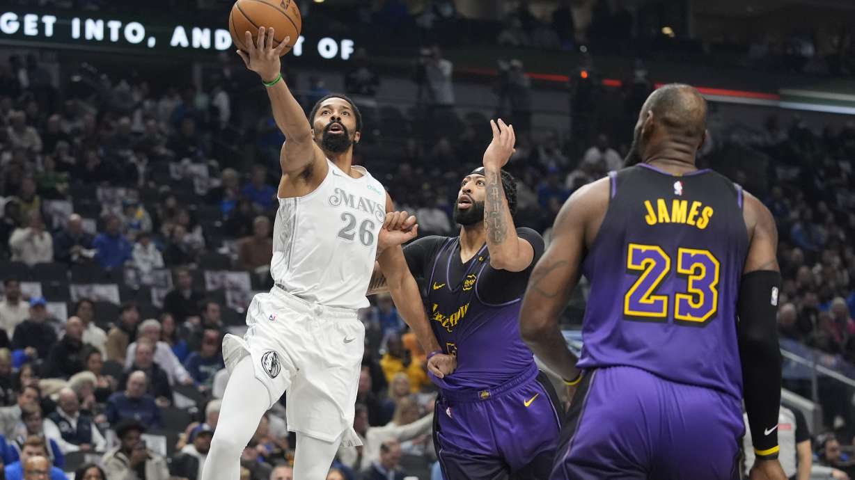 Dallas Mavericks forward P.J. Washington (25) drives against Los Angeles Lakers forwards Anthony Davis (3) and LeBron James (23) during the first half of an NBA basketball game Tuesday, Jan. 7, 2025, in Dallas.