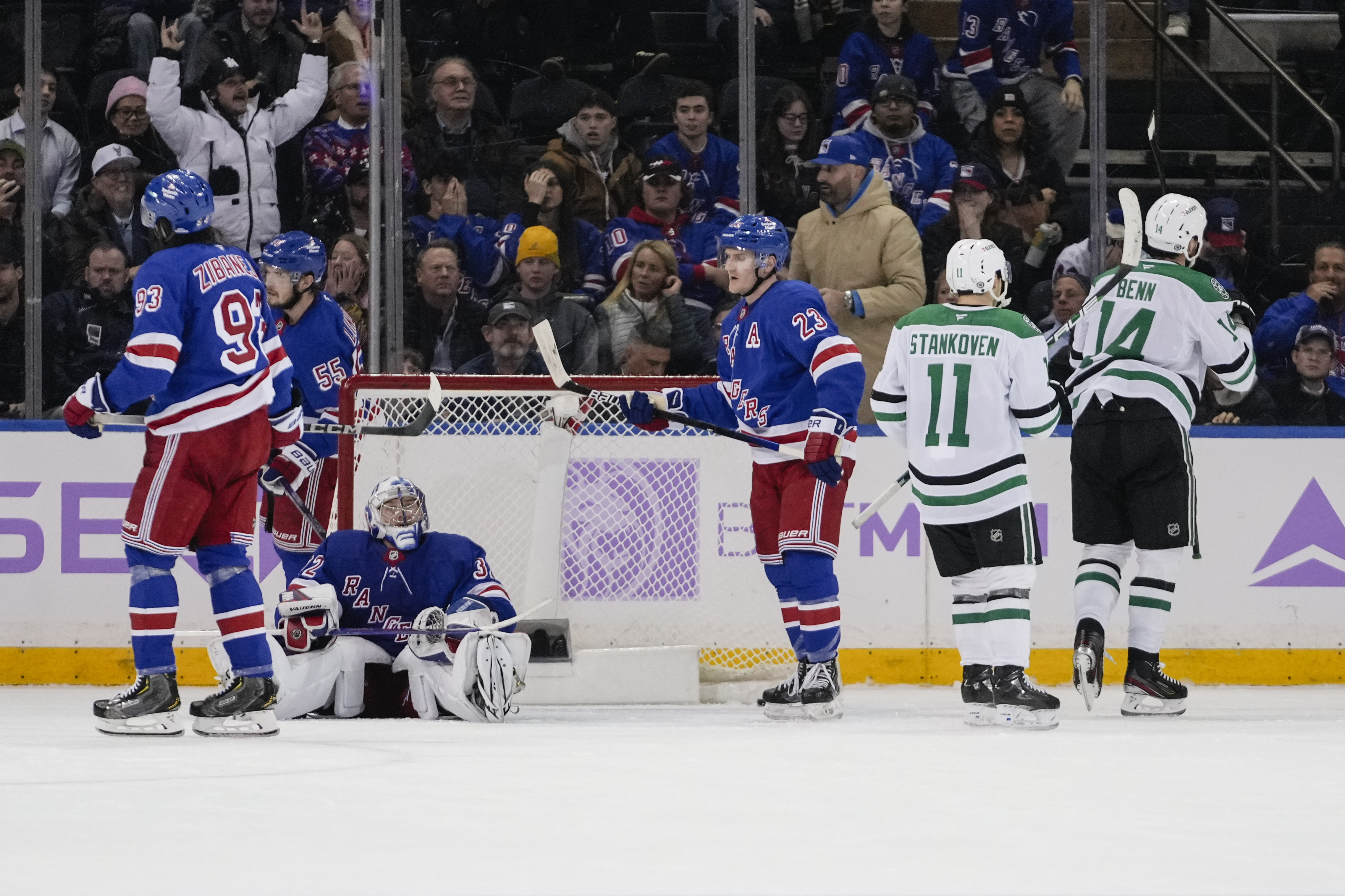 New York Rangers goaltender Jonathan Quick (32), Mika Zibanejad (93) and Adam Fox (23) react after Dallas Stars' Jamie Benn (14) scored a goal during the overtime period of an NHL hockey game, Tuesday, Jan. 7, 2025, in New York.