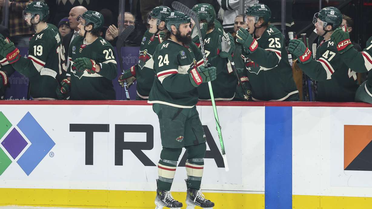 Minnesota Wild defenseman Zach Bogosian (24) is congratulated for his goal against the St. Louis Blues during the first period of an NHL hockey game Tuesday, Jan. 7, 2025, in St. Paul, Minn.