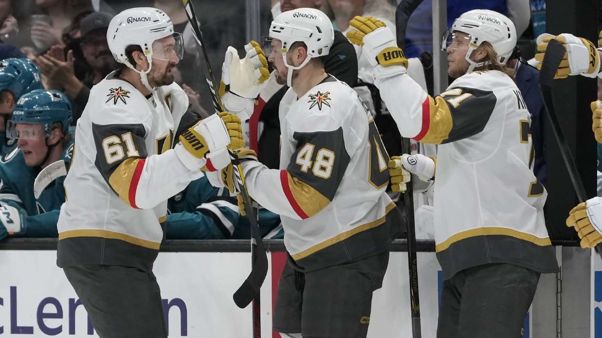 Vegas Golden Knights right wing Mark Stone (61) is congratulated by center Tomas Hertl (48) and center William Karlsson after scoring against the San Jose Sharks during the first period of an NHL hockey game in San Jose, Calif., Tuesday, Jan. 7, 2025.