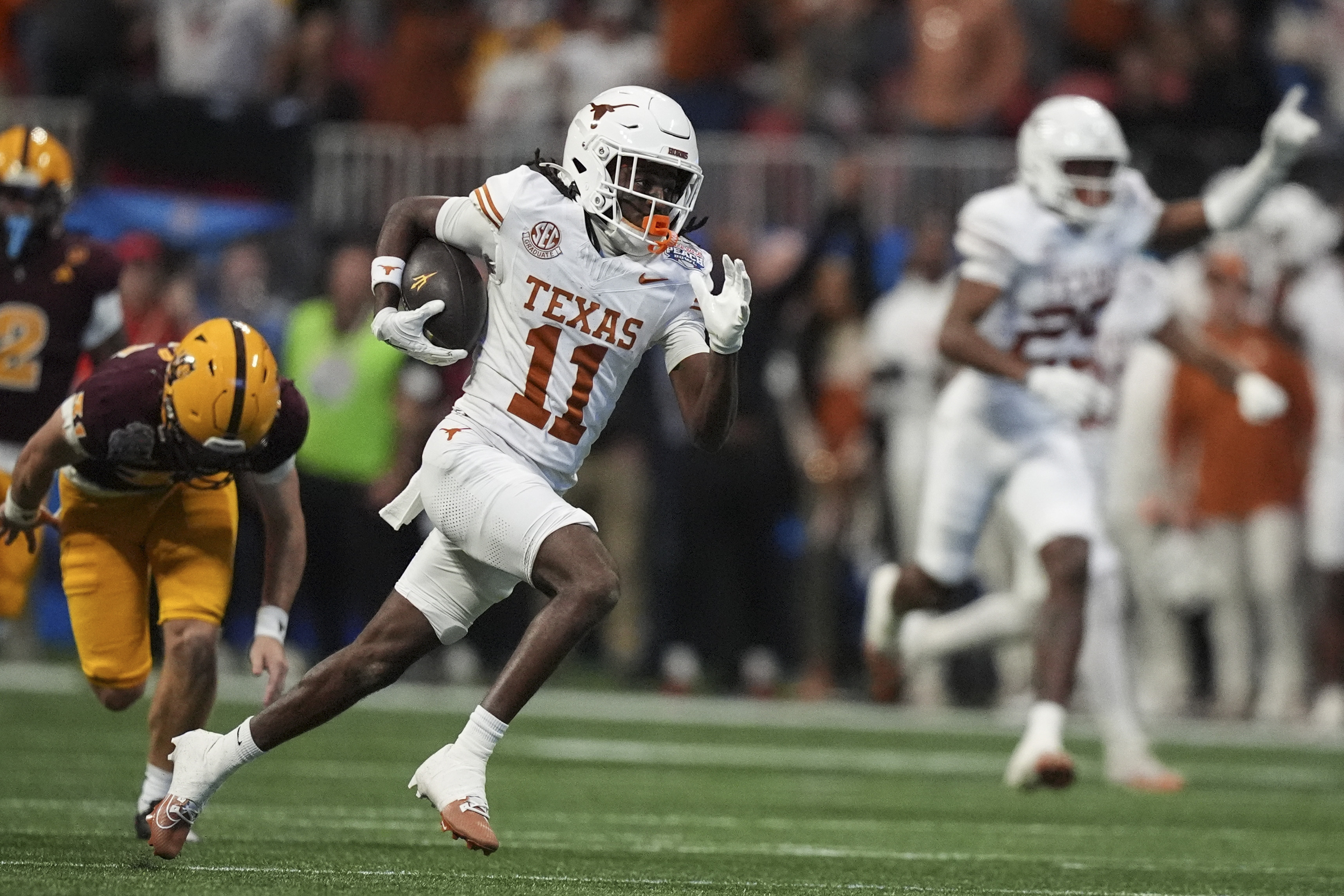 Texas wide receiver Silas Bolden (11) runs against Arizona State during the first half in the quarterfinals of a College Football Playoff, Wednesday, Jan. 1, 2025, in Atlanta.