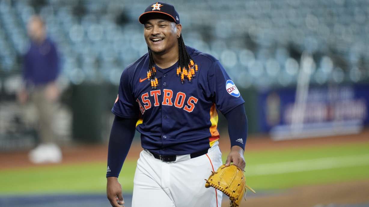 FILE - Houston Astros pitcher Luis Garcia smiles after throwing live batting practice before a baseball game against the Minnesota Twins Friday, May 31, 2024, in Houston.
