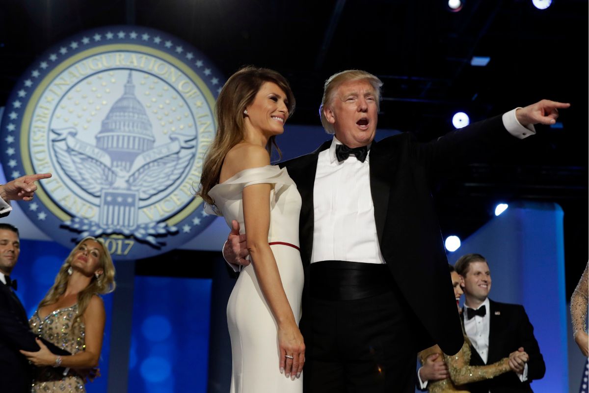 President Donald Trump acknowledges the crowd with first lady Melania Trump at the Freedom Ball on Inauguration Day, Friday, Jan. 20, 2017, in Washington.