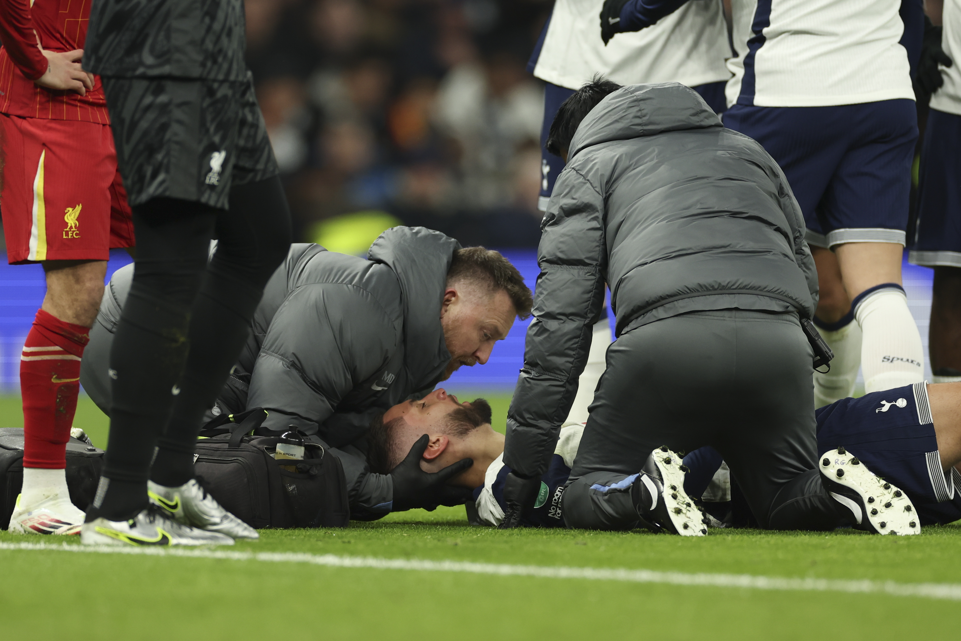 Tottenham's Rodrigo Bentancur receives medical treatment during the English League Cup semi final first leg soccer match between Tottenham and Liverpool, at the Tottenham Hotspur Stadium in London, Wednesday, Jan. 8, 2025.