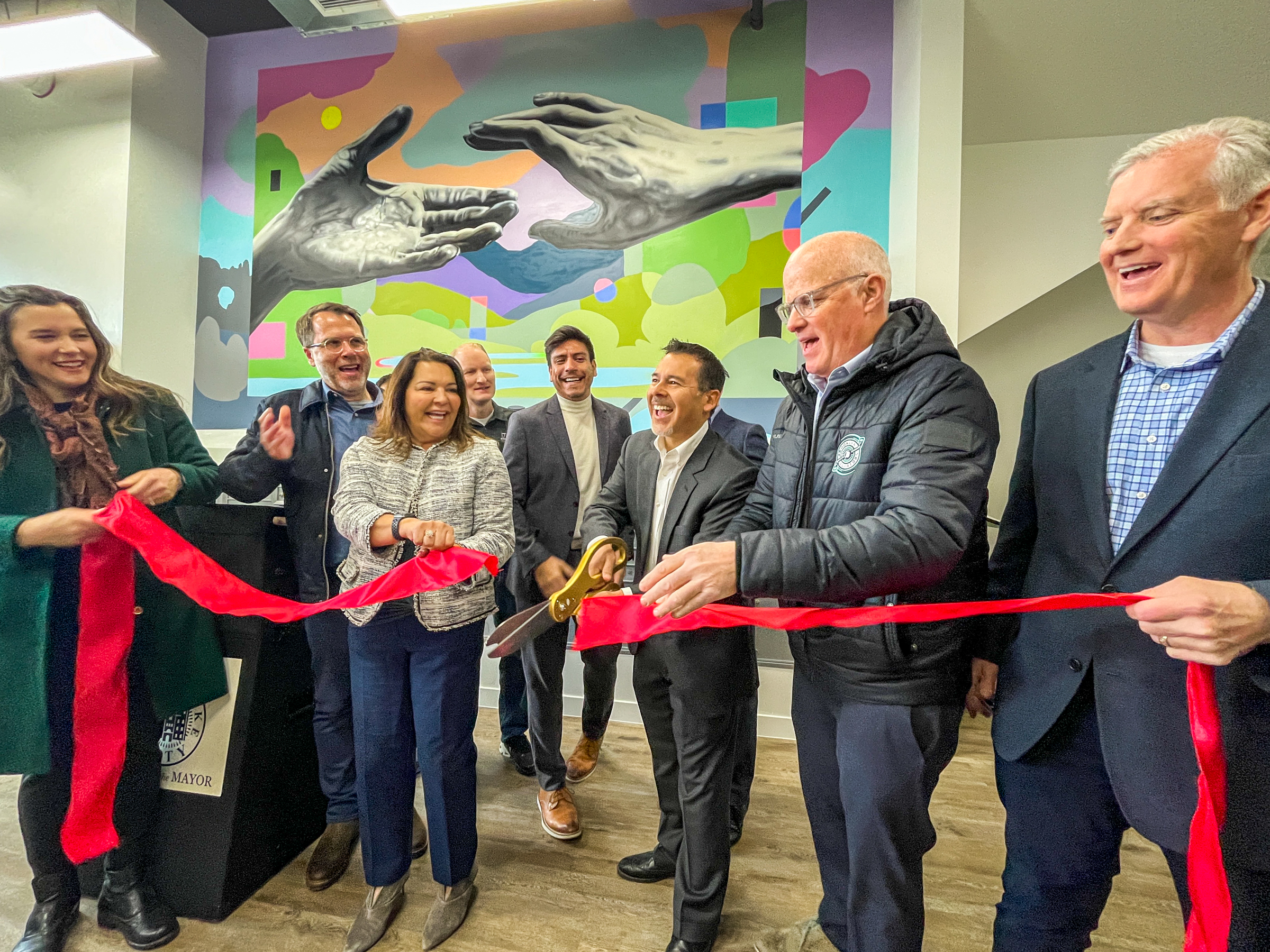 Developers, city and county leaders and others cut a ribbon Wednesday to celebrate the opening of the 144 South apartment complex in Salt Lake City.