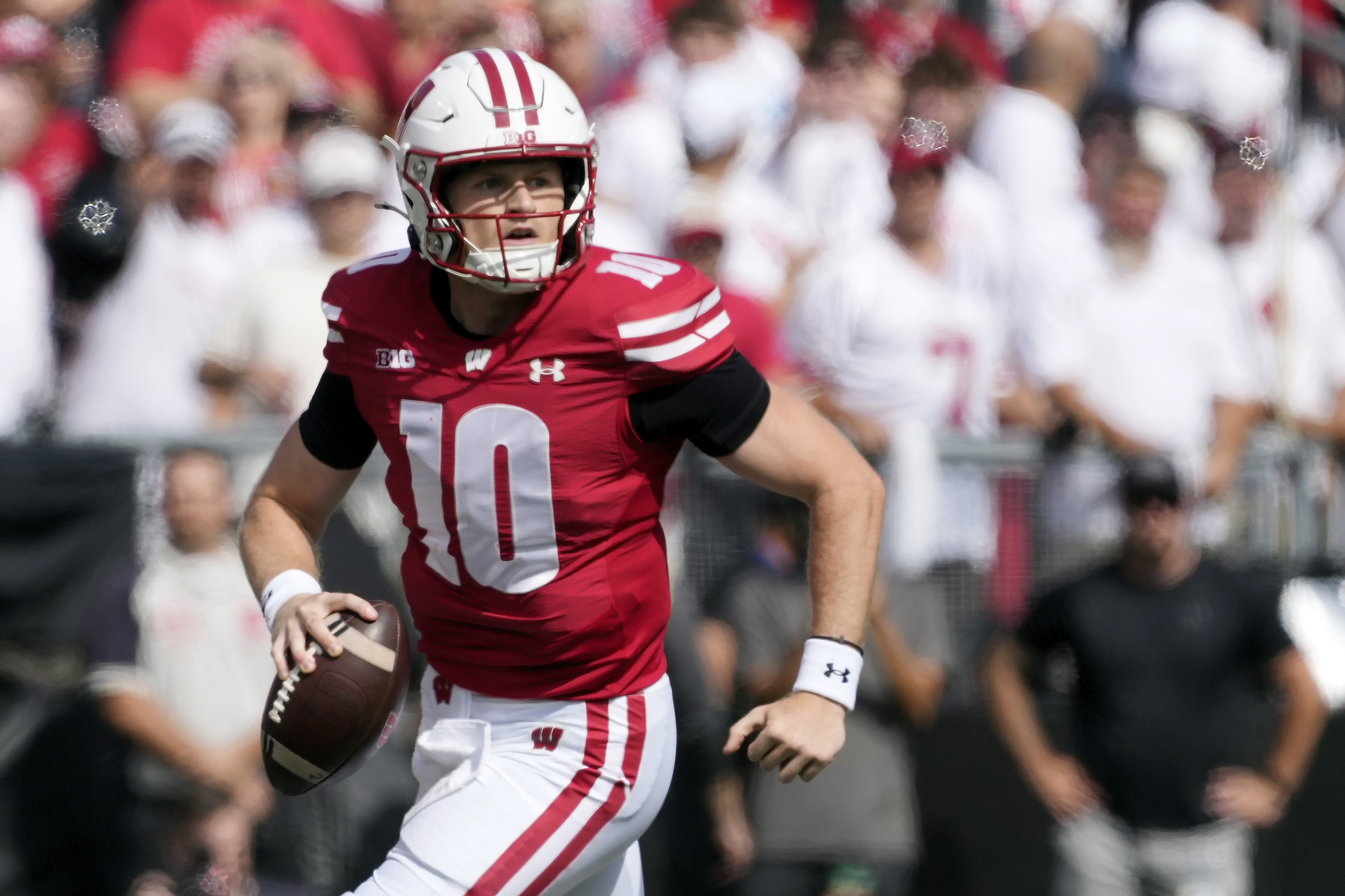FILE - Wisconsin's Tyler Van Dyke (10) looks for a reciever during the first half of an NCAA college football game against Alabama, Saturday, Sept. 14, 2024, in Madison, Wis.