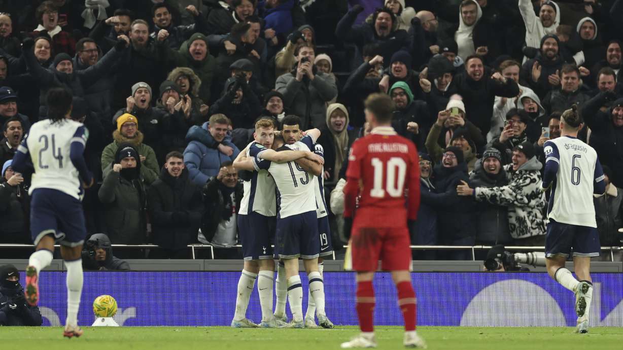 Tottenham's Dominic Solanke celebrates with teammates after scores a disallowed goal during the English League Cup semi final first leg soccer match between Tottenham and Liverpool, at the Tottenham Hotspur Stadium in London, Wednesday, Jan. 8, 2025.