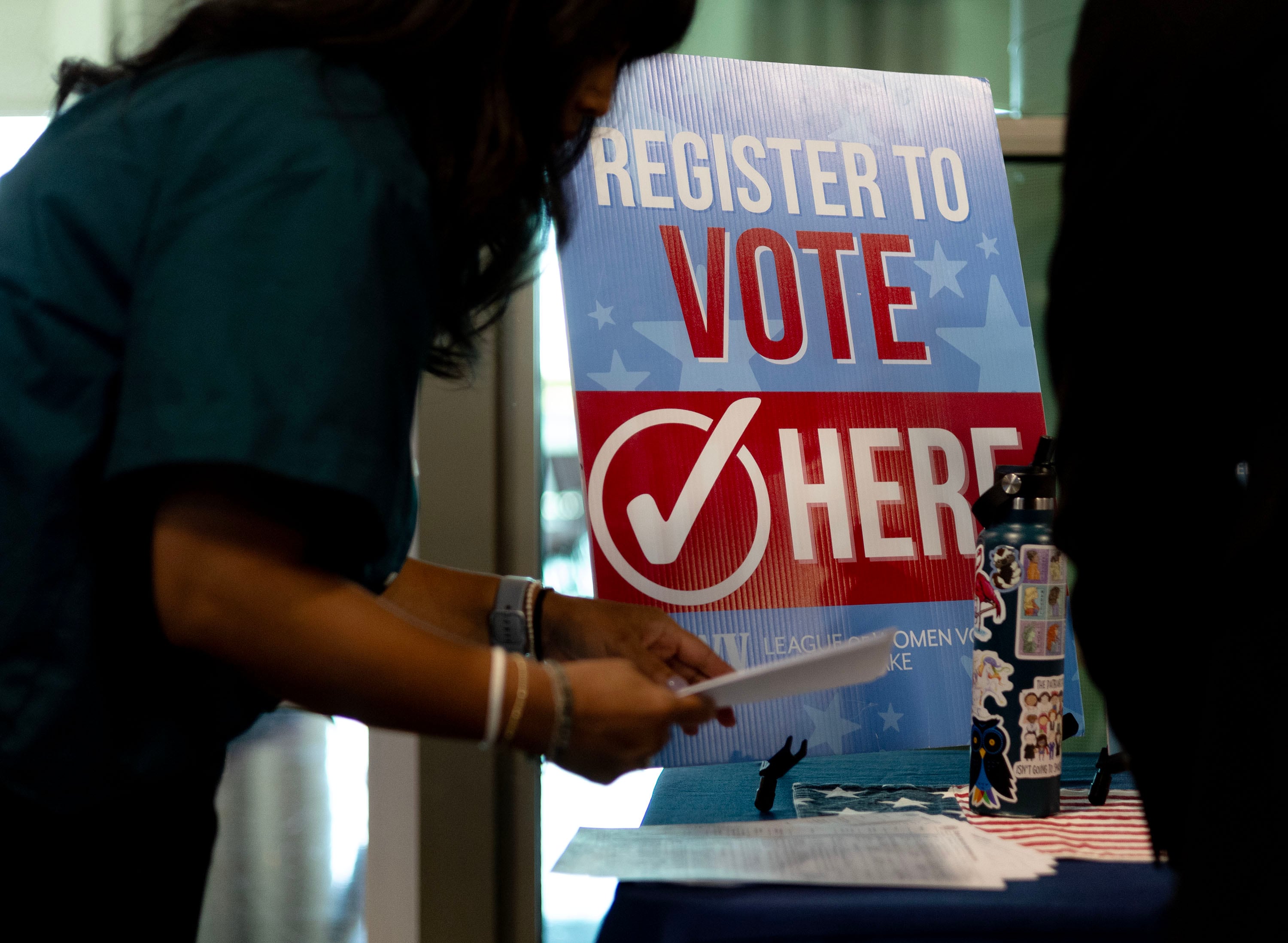 New citizens had the opportunity to register to vote at the League of Women Voters of Salt Lake table following a citizenship oath ceremony at the Utah Cultural Celebration Center in West Valley City on Sept. 13, 2024.