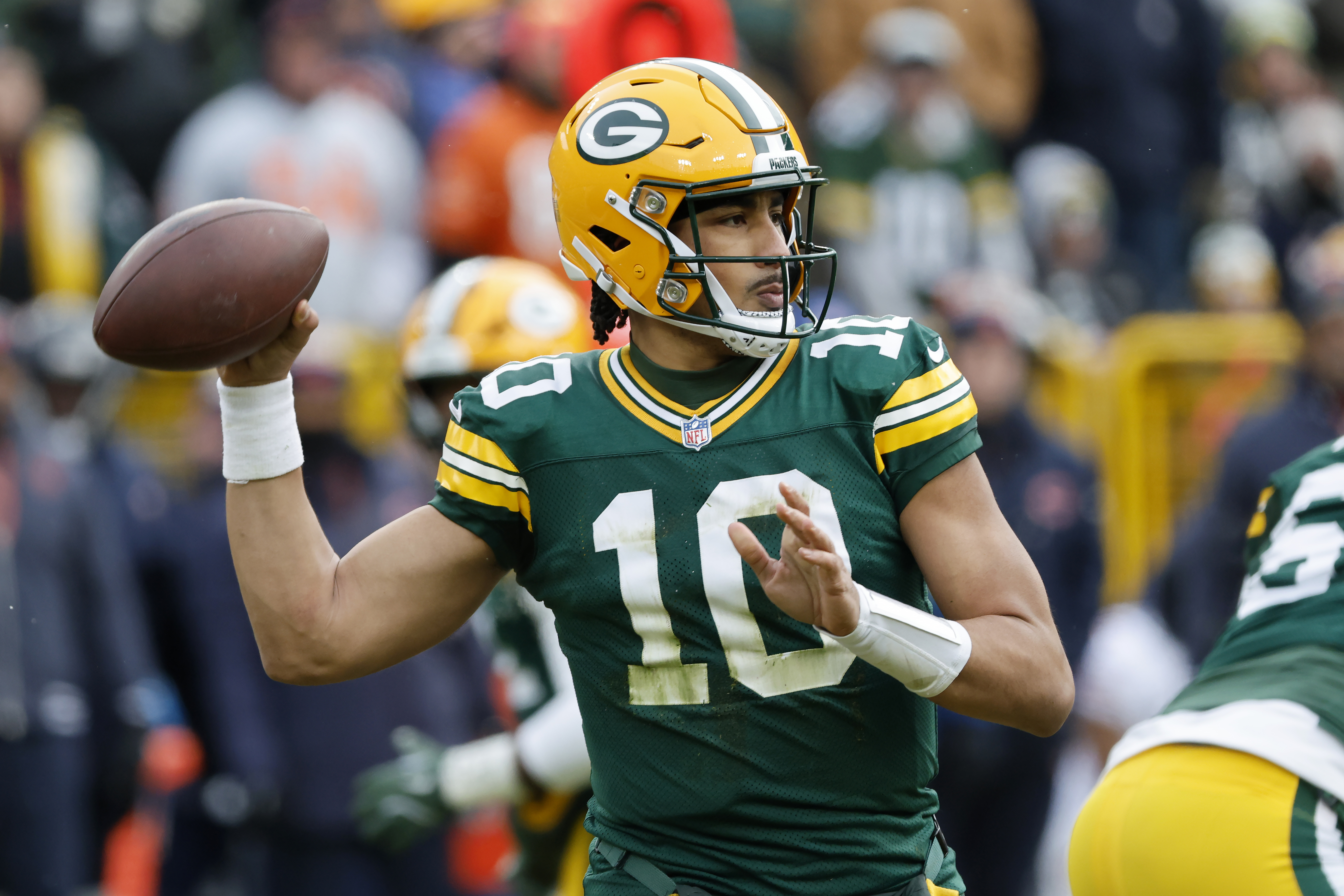 Green Bay Packers quarterback Jordan Love (10) passes against the Chicago Bears during the first half of an NFL football game, Sunday, Jan. 5, 2025, in Green Bay, Wis.