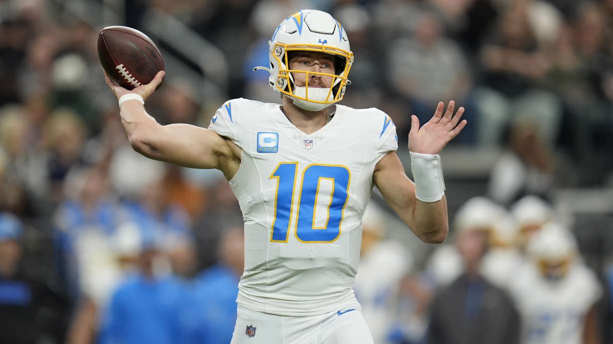 Los Angeles Chargers quarterback Justin Herbert (10) passes against the Las Vegas Raiders during the first half of an NFL football game in Las Vegas, Sunday, Jan. 5, 2025.