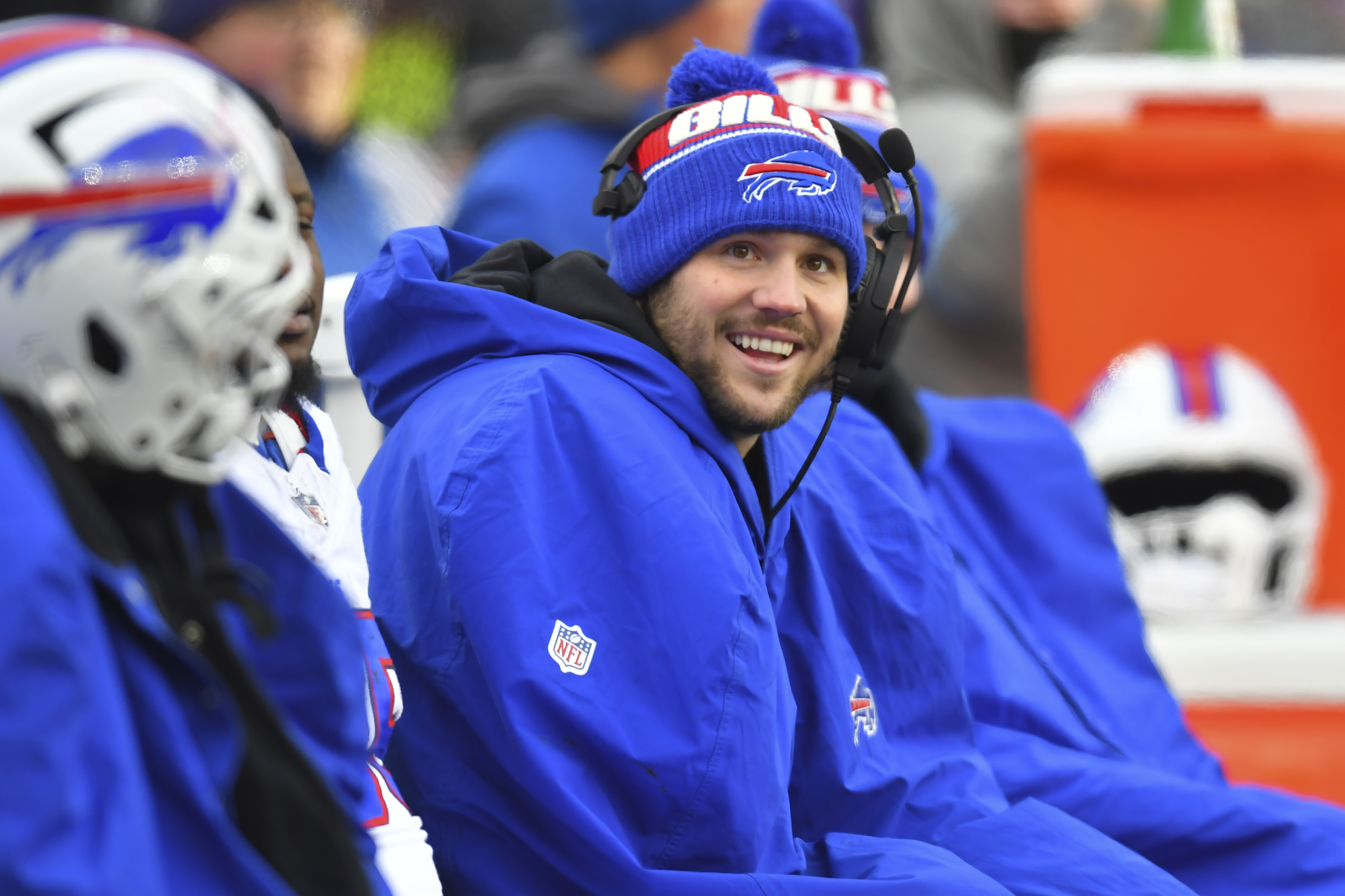 Buffalo Bills quarterback Josh Allen smiles while sitting on the bench during the second half of an NFL football game against the New England Patriots, Sunday, Jan. 5, 2025, in Foxborough, Mass. 