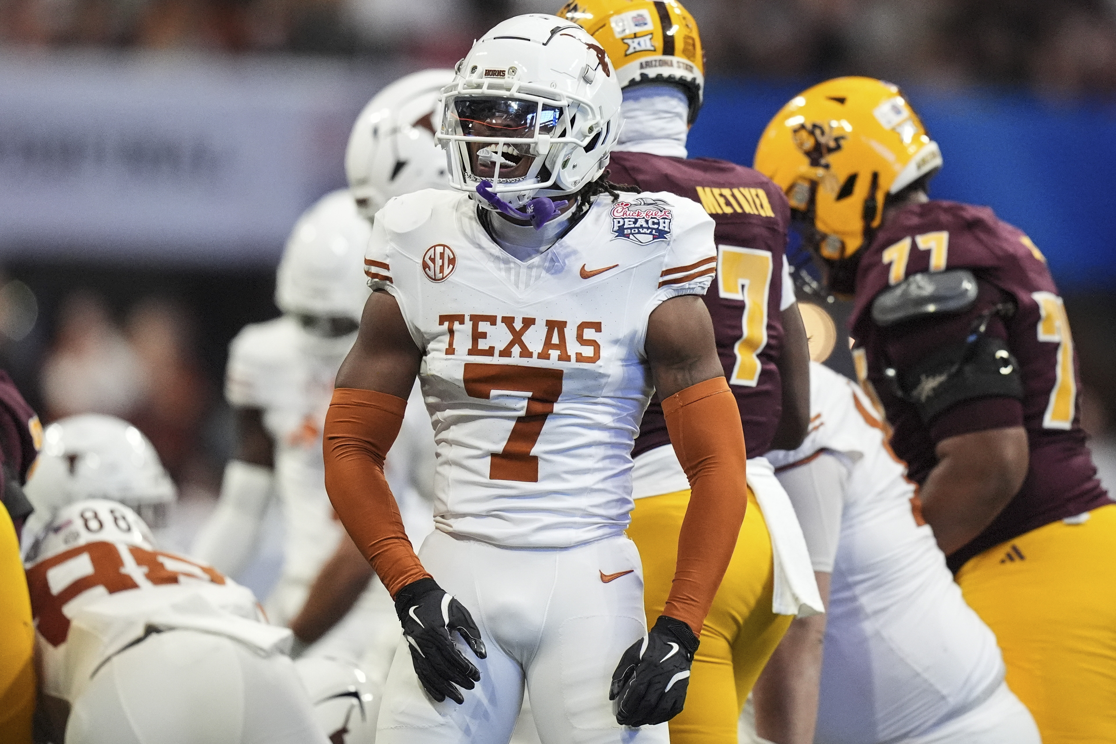 Texas defensive back Jahdae Barron (7) celebrates a defensive play against Arizona State during the first half in the quarterfinals of a College Football Playoff, Wednesday, Jan. 1, 2025, in Atlanta.