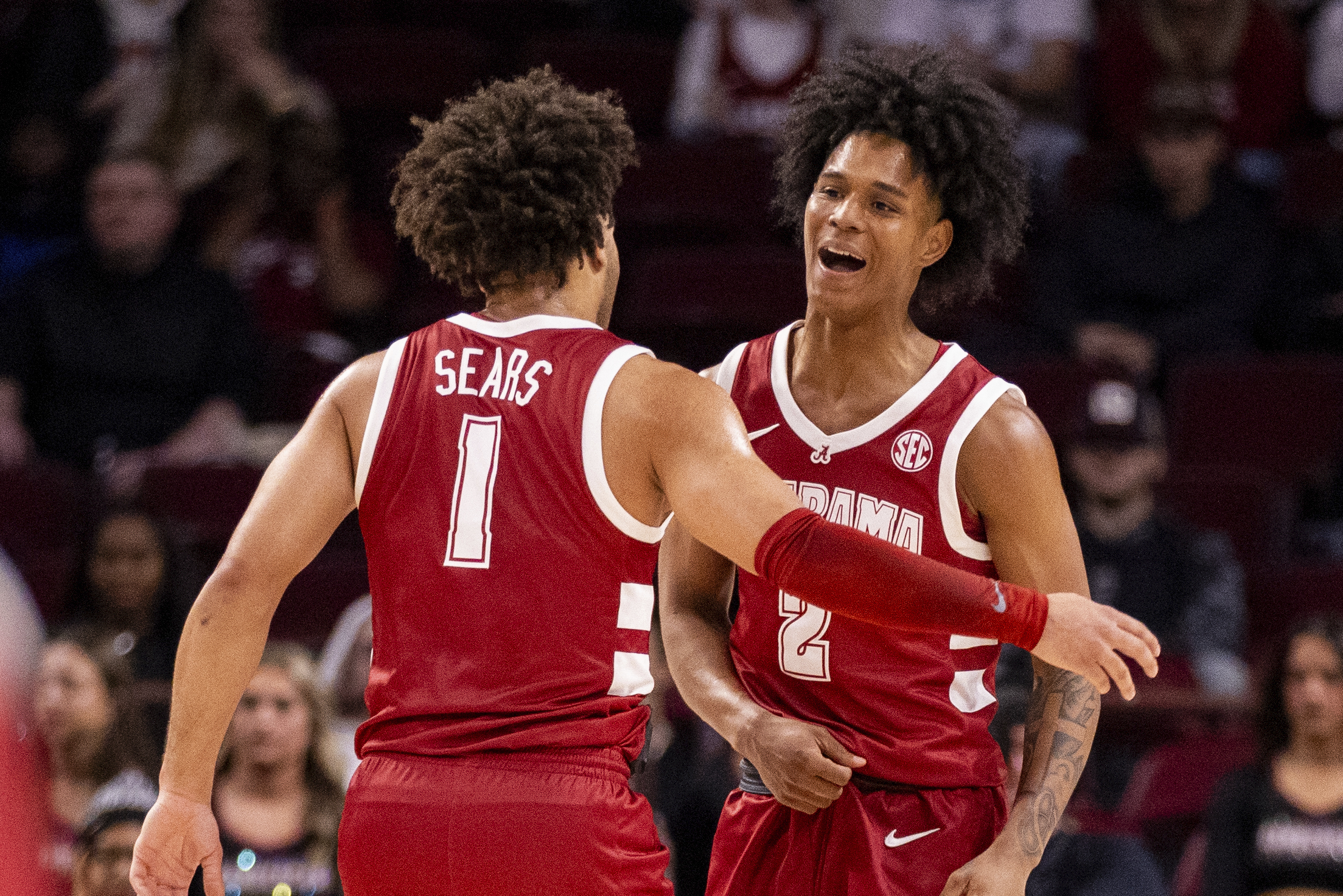 Alabama guard Aden Holloway (2) celebrates with guard Mark Sears (1) against South Carolina during the first half of an NCAA college basketball game on Wednesday, Jan. 8, 2025, in Columbia, S.C.