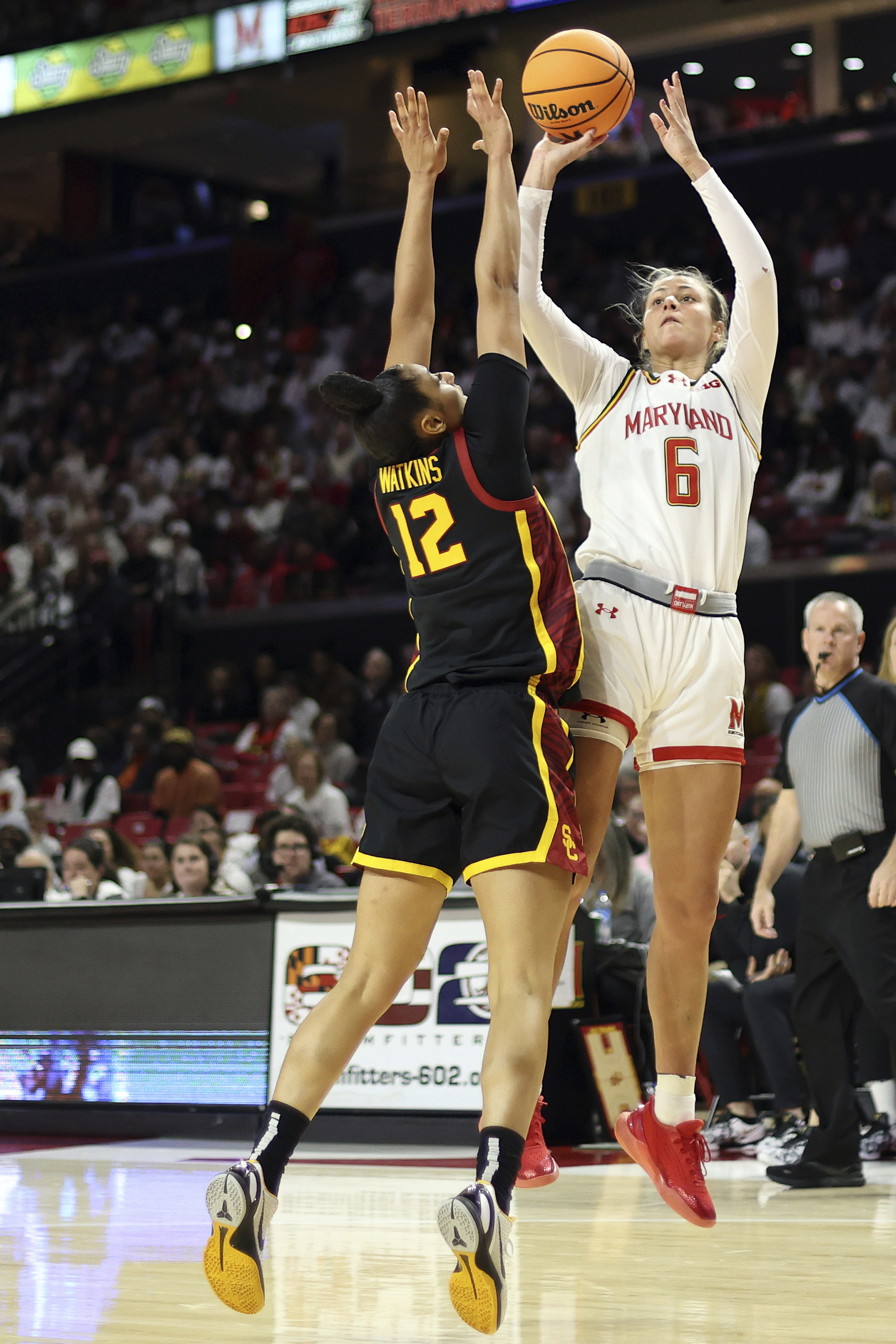 Maryland guard Saylor Poffenbarger (6) takes a shot over Southern California guard JuJu Watkins (12) during the first half of an NCAA college basketball game, Wednesday, Jan. 8, 2025, in College Park, Md.