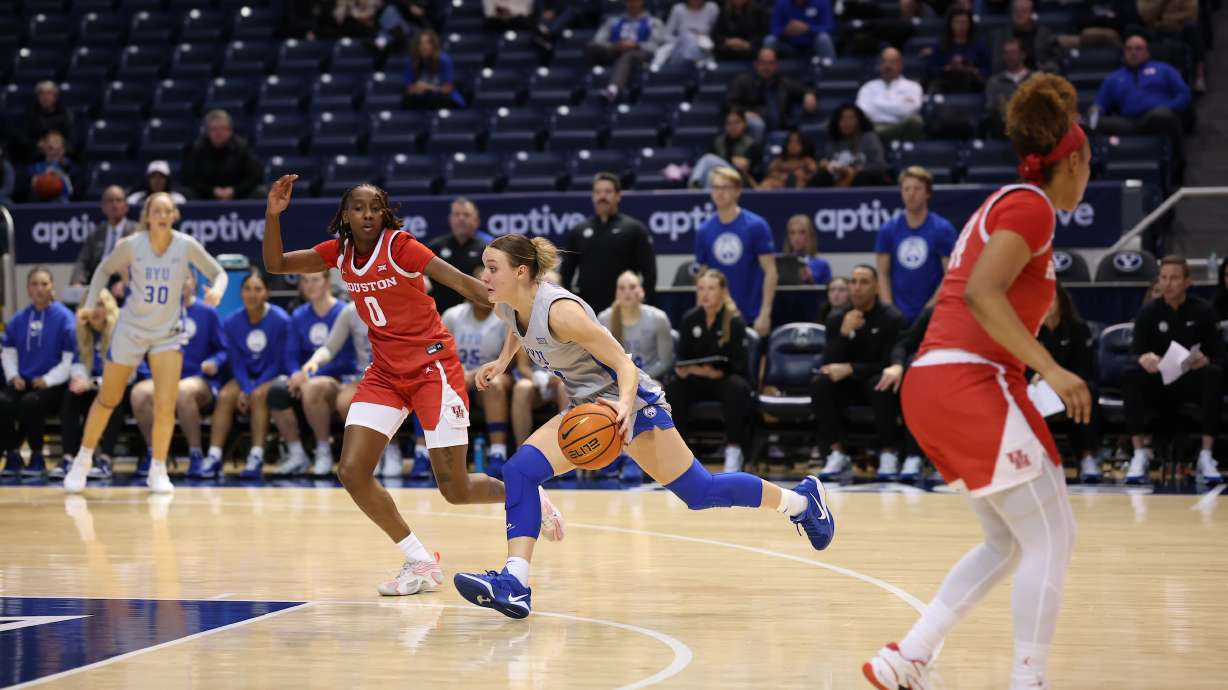 BYU point guard Amari Whiting drives to the rim against Houston during a Big 12 women's basketball game, Wednesday, Jan. 8, 2024, at the Marriott Center in Provo, Utah.
