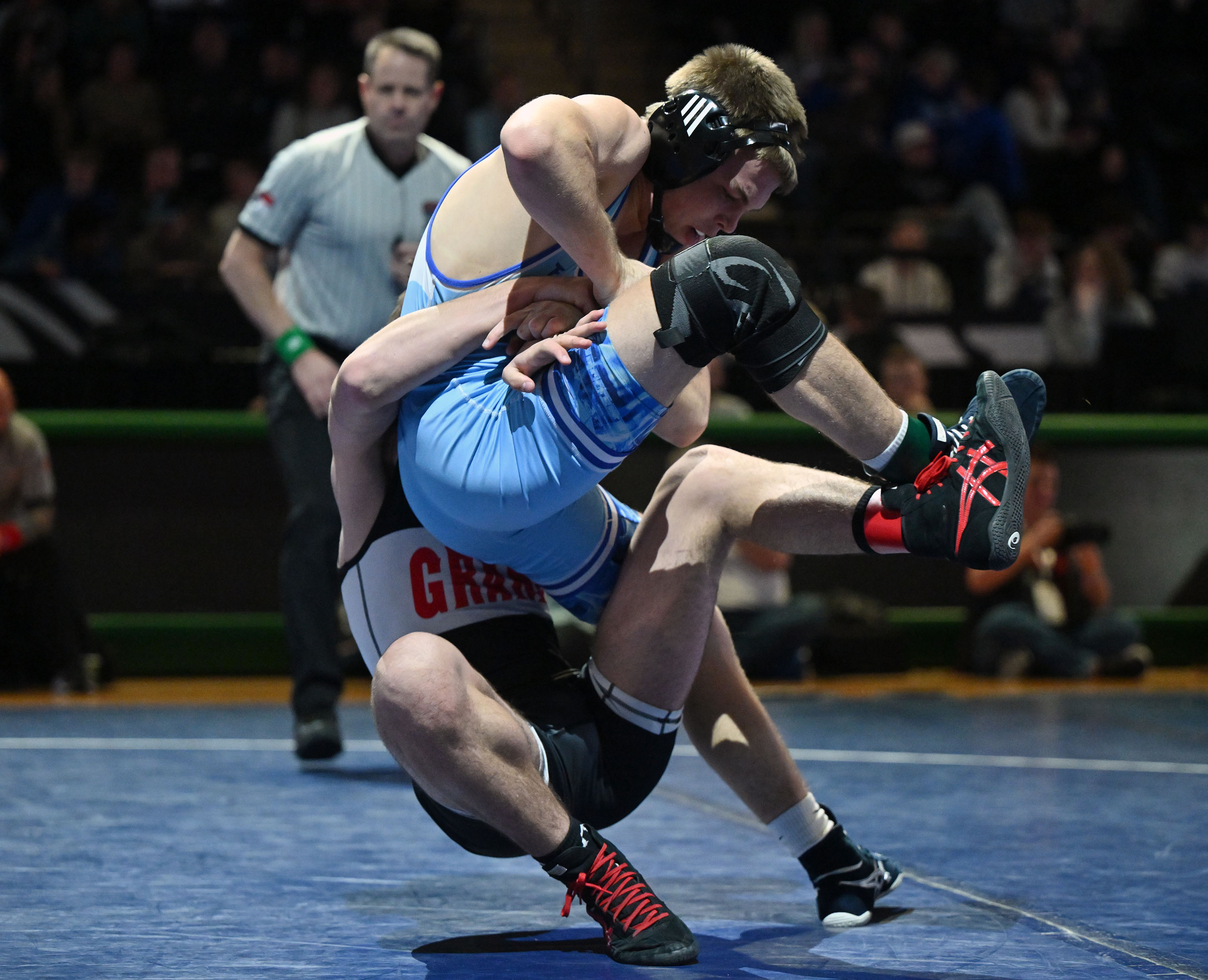 Ian Fritz of Pleasant Grove is taken to the mat by Austin Paris of Grand as they and other high school wrestlers compete in the Ross Brunson All-Star Dual at UVU’s UCCU Center in Orem on Wednesday, Jan. 8, 2025.