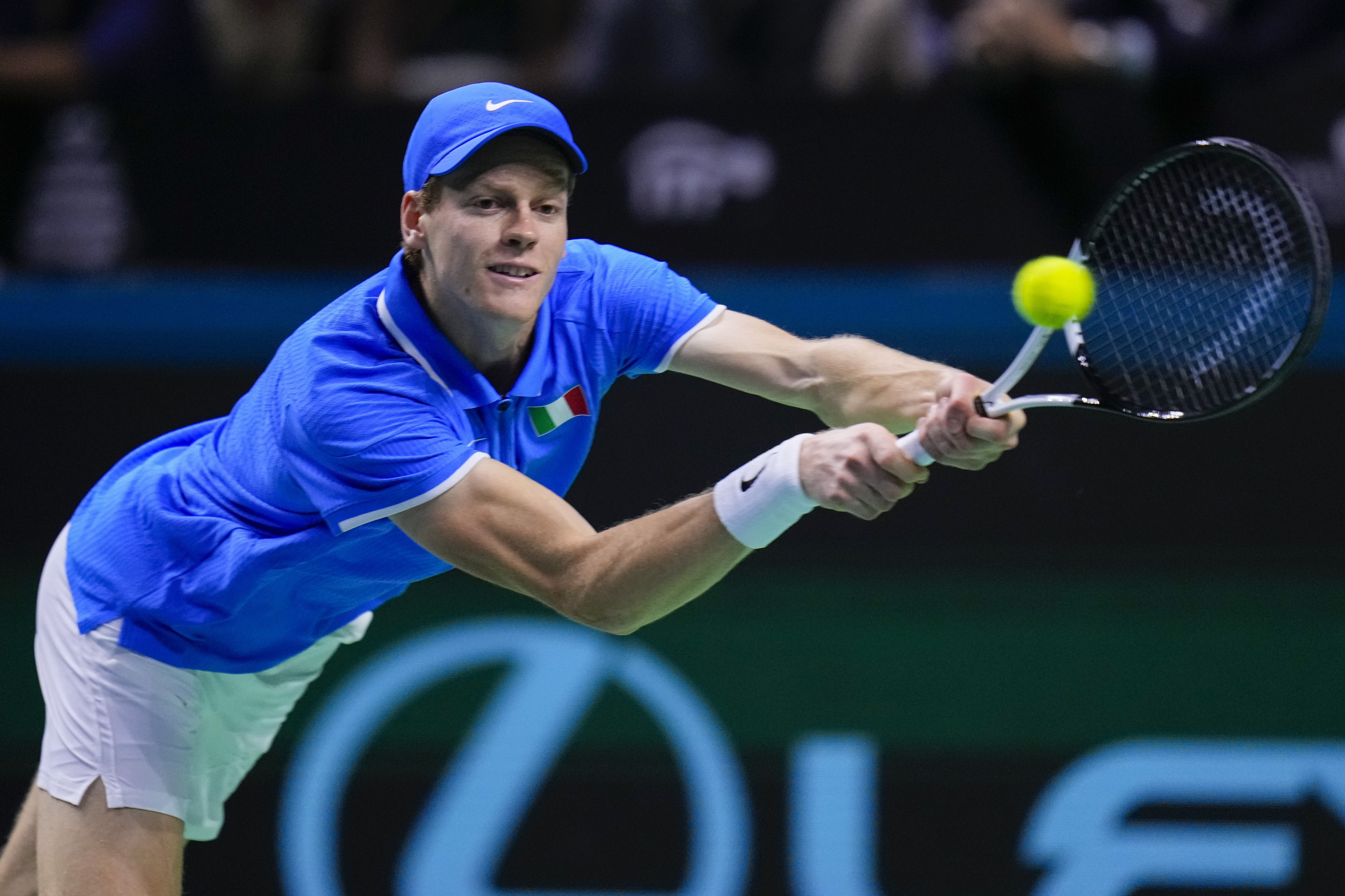 FILE - Italy's Jannik Sinner returns the ball to Netherlands' Tallon Griekspoor during the Davis Cup final tennis match between Netherlands and Italy at the Martin Carpena Sports Hall in Malaga, southern Spain, Sunday, Nov. 24, 2024.