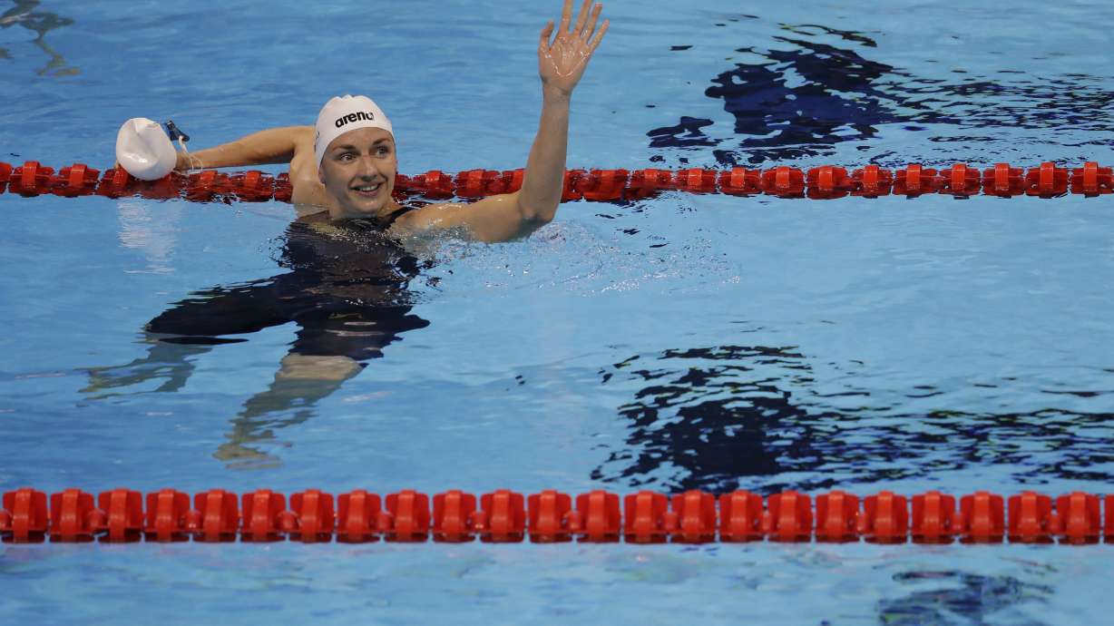 FILE - Hungary's Katinka Hosszu waves after winning a semifinal of the women's 200-meter backstroke during the swimming competitions at the 2016 Summer Olympics, Thursday, Aug. 11, 2016, in Rio de Janeiro, Brazil.