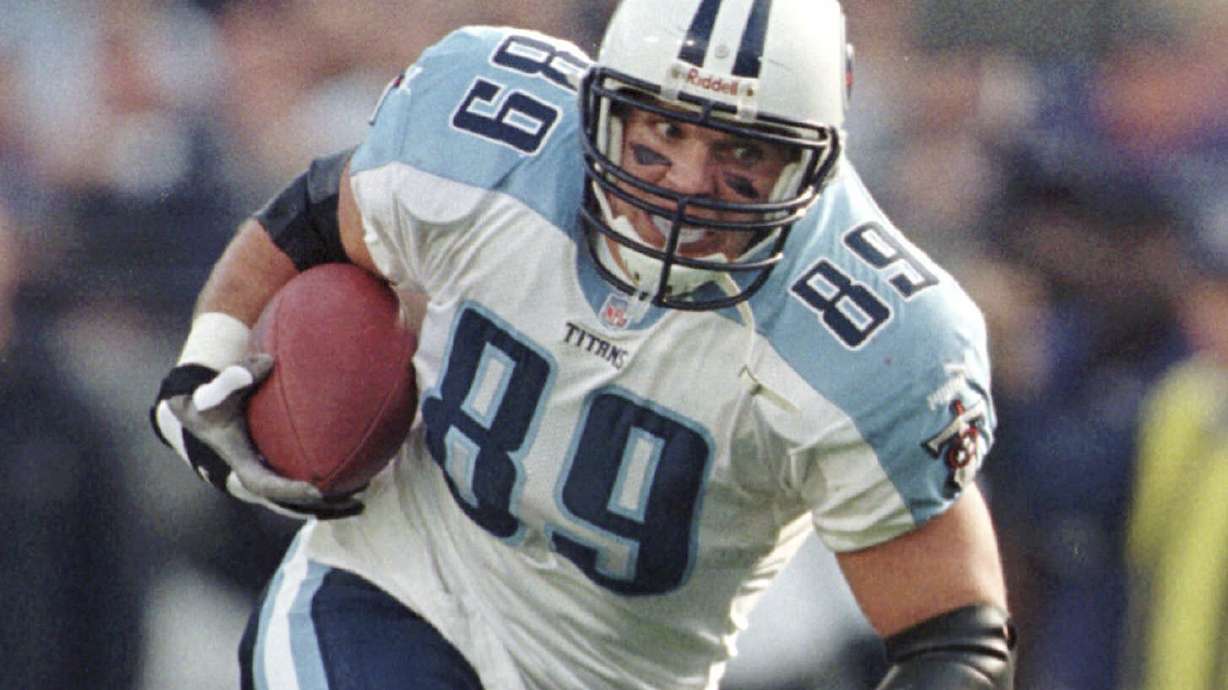 FILE - Tennessee Titans tight end Frank Wycheck runs with the ball during a football game against the Baltimore Ravens, Dec. 5, 1999, in Baltimore.
