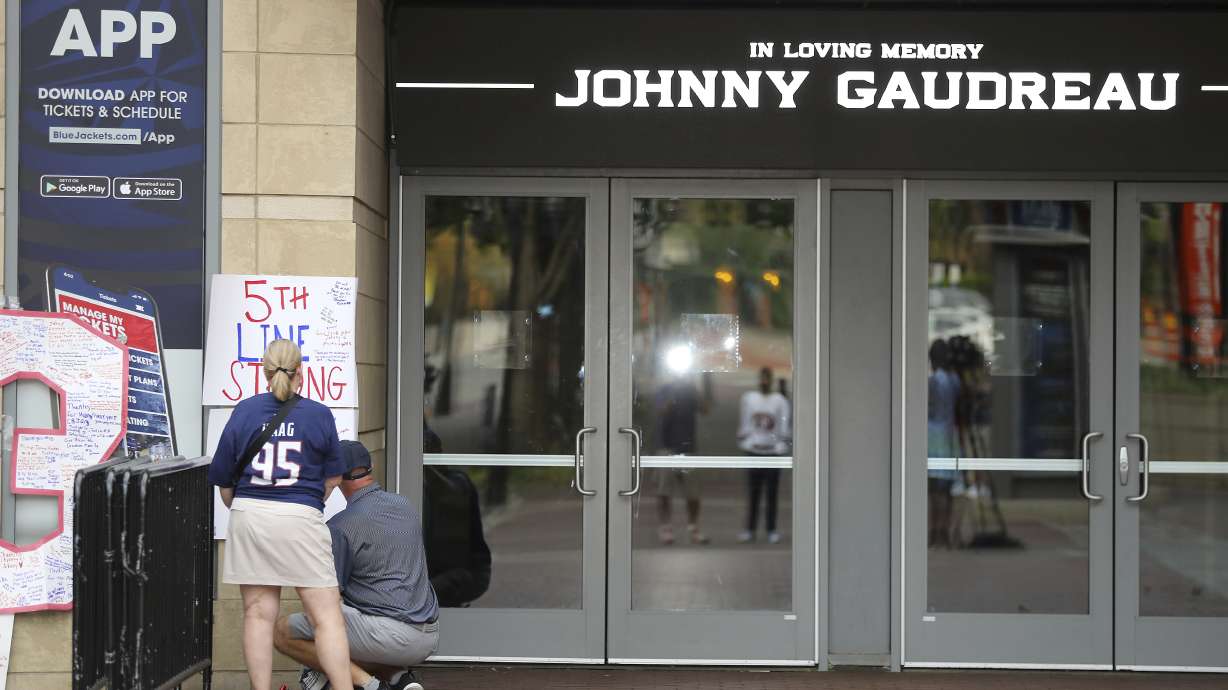 FILE - The view outside of Nationwide Arena at a memorial set up by fans for Blue Jackets hockey player Johnny Gaudreau in Columbus, Ohio, Aug. 30, 2024.