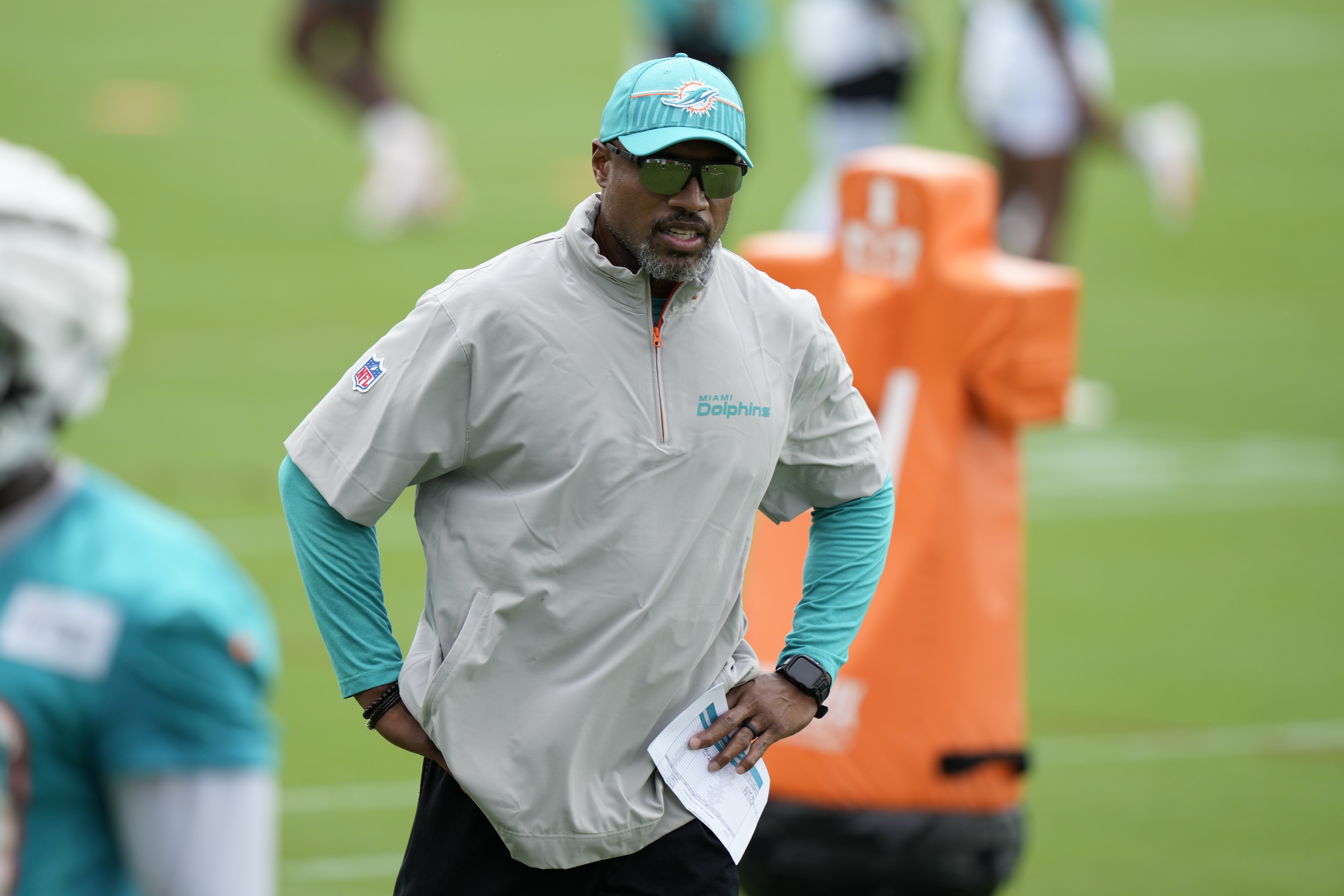 FILE - Miami Dolphins defensive coordinator Anthony Weaver watches players during NFL football training camp, July 24, 2024, in Miami Gardens, Fla.