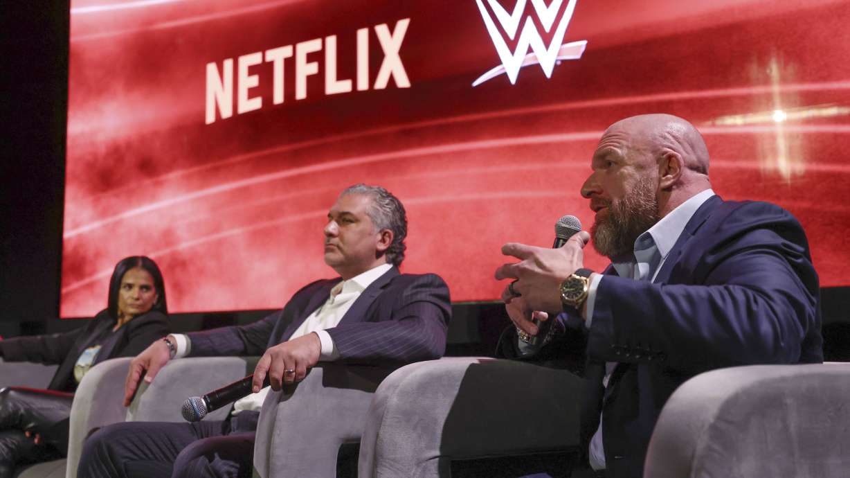 From left, Netflix Chief Content Officer Bela Bajaria, WWE President Nick Khan and WWE Chief Content Officer Paul "Triple H" Levesque discuss the World Wrestling Entertainment and Netflix during an event at Netflix's headquarters in Los Angeles on Dec. 3, 2024.