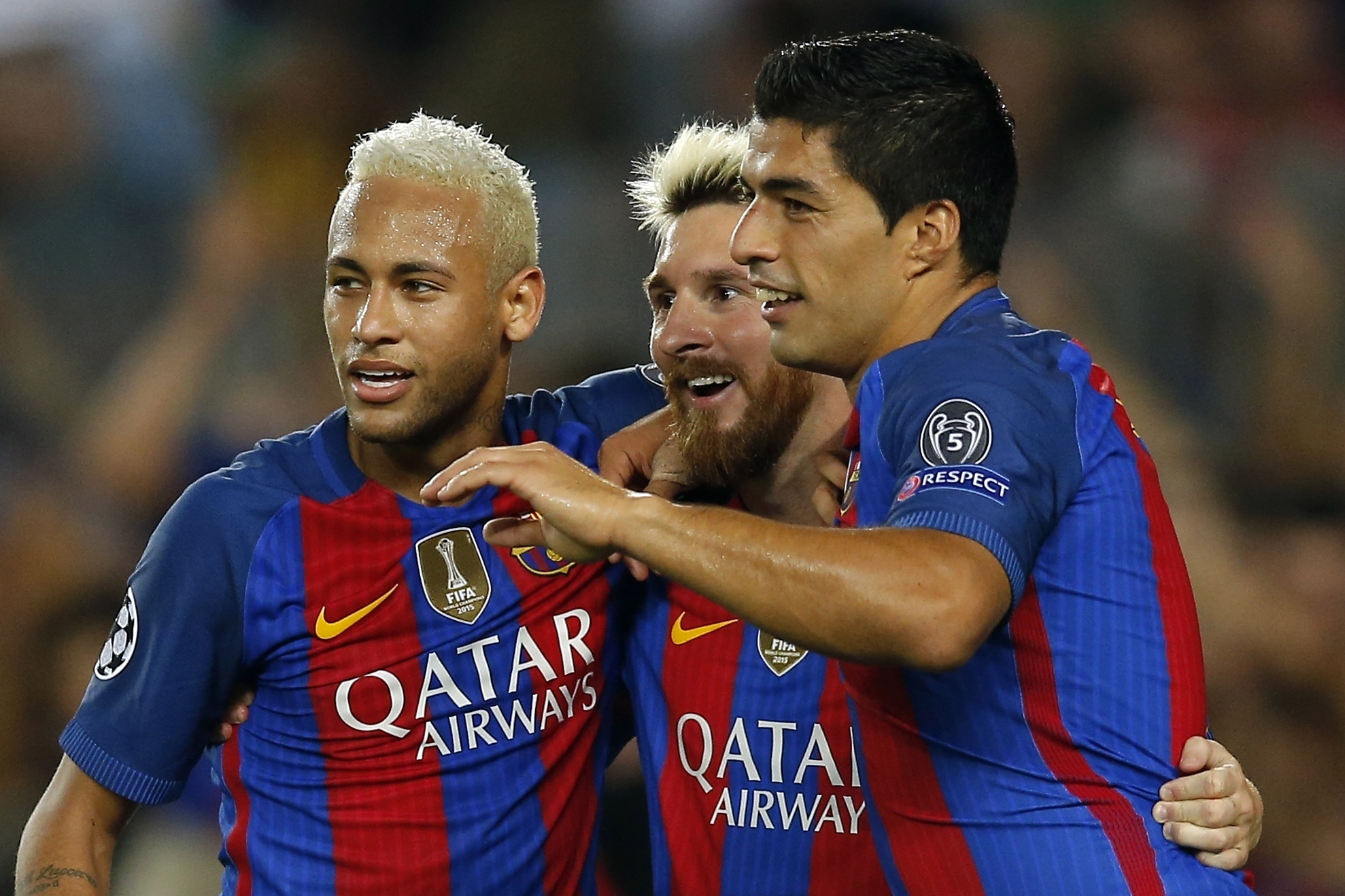 FILE -Barcelona's Lionel Messi, center, celebrates with his teammates Luis Suarez, right, and Neymar after scoring his side's fifth goal during a Champions League, Group C soccer match between Barcelona and Celtic, at the Camp Nou stadium in Barcelona, Spain, Tuesday, Sept. 13, 2016.