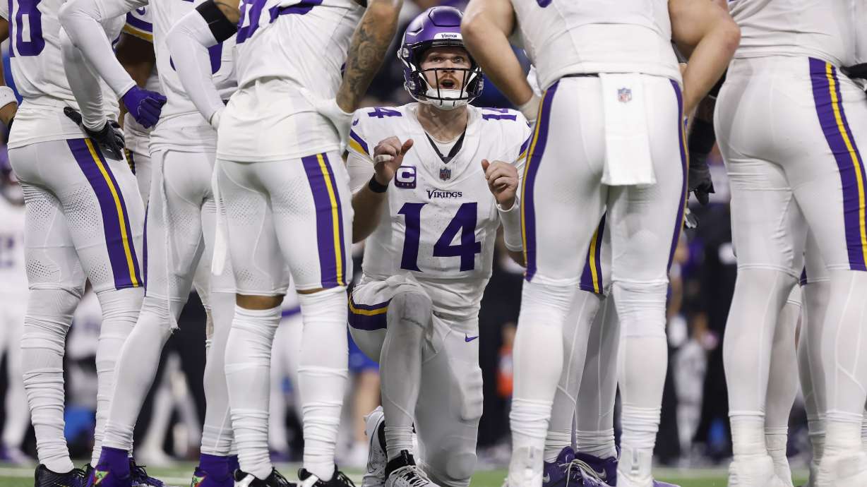 Minnesota Vikings quarterback Sam Darnold (14) calls a play during the second half of an NFL football game against the Detroit Lions, Sunday, Jan. 5, 2025, in Detroit.