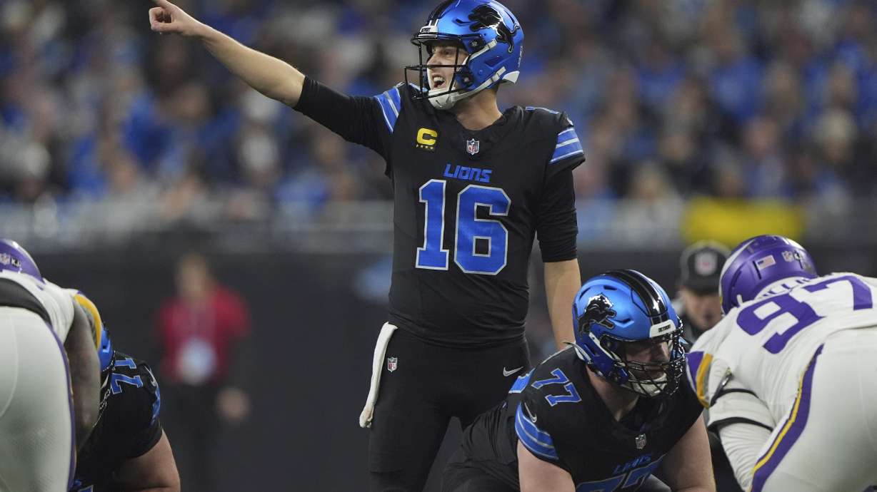 Detroit Lions quarterback Jared Goff (16) signals during the first half of an NFL football game against the Minnesota Vikings, Sunday, Jan. 5, 2025, in Detroit.