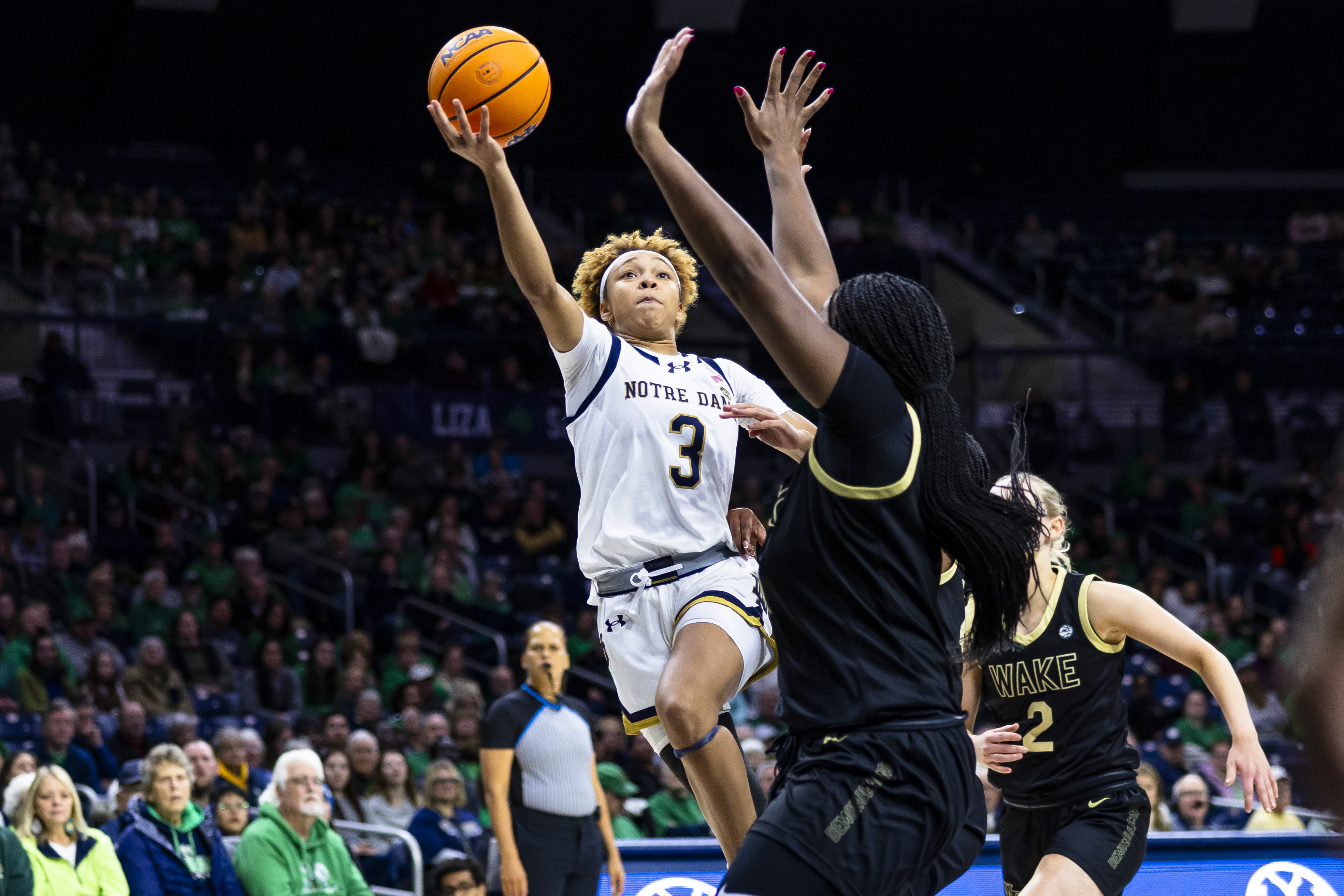 Notre Dame guard Hannah Hidalgo (3) shoots as Wake Forest forward Malaya Cowles, front, defends during the second half of an NCAA college basketball game Thursday, Jan. 9, 2025, in South Bend, Ind. 