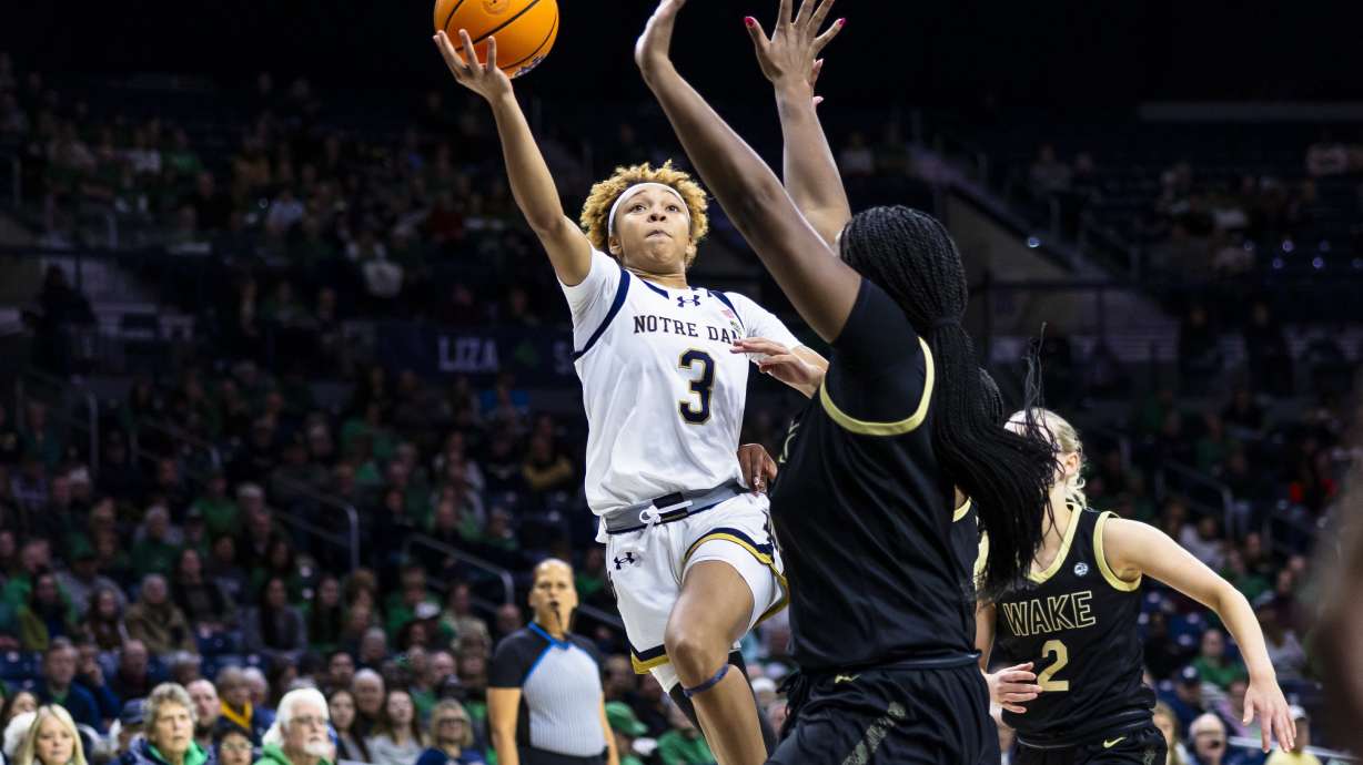 Notre Dame guard Hannah Hidalgo (3) shoots as Wake Forest forward Malaya Cowles, front, defends during the second half of an NCAA college basketball game Thursday, Jan. 9, 2025, in South Bend, Ind.