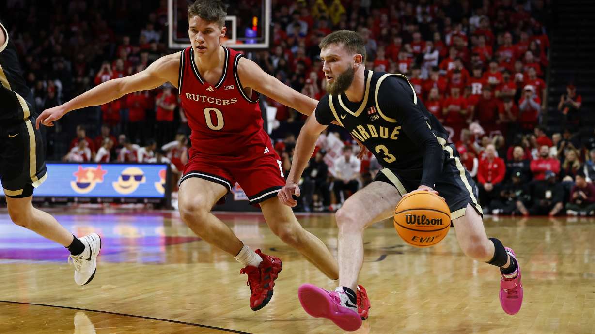 Purdue guard Braden Smith (3) drives to the basket against Rutgers guard Jordan Derkack (0) during the first half of an NCAA college basketball game, Thursday, Jan. 9, 2025, in Piscataway, N.J.