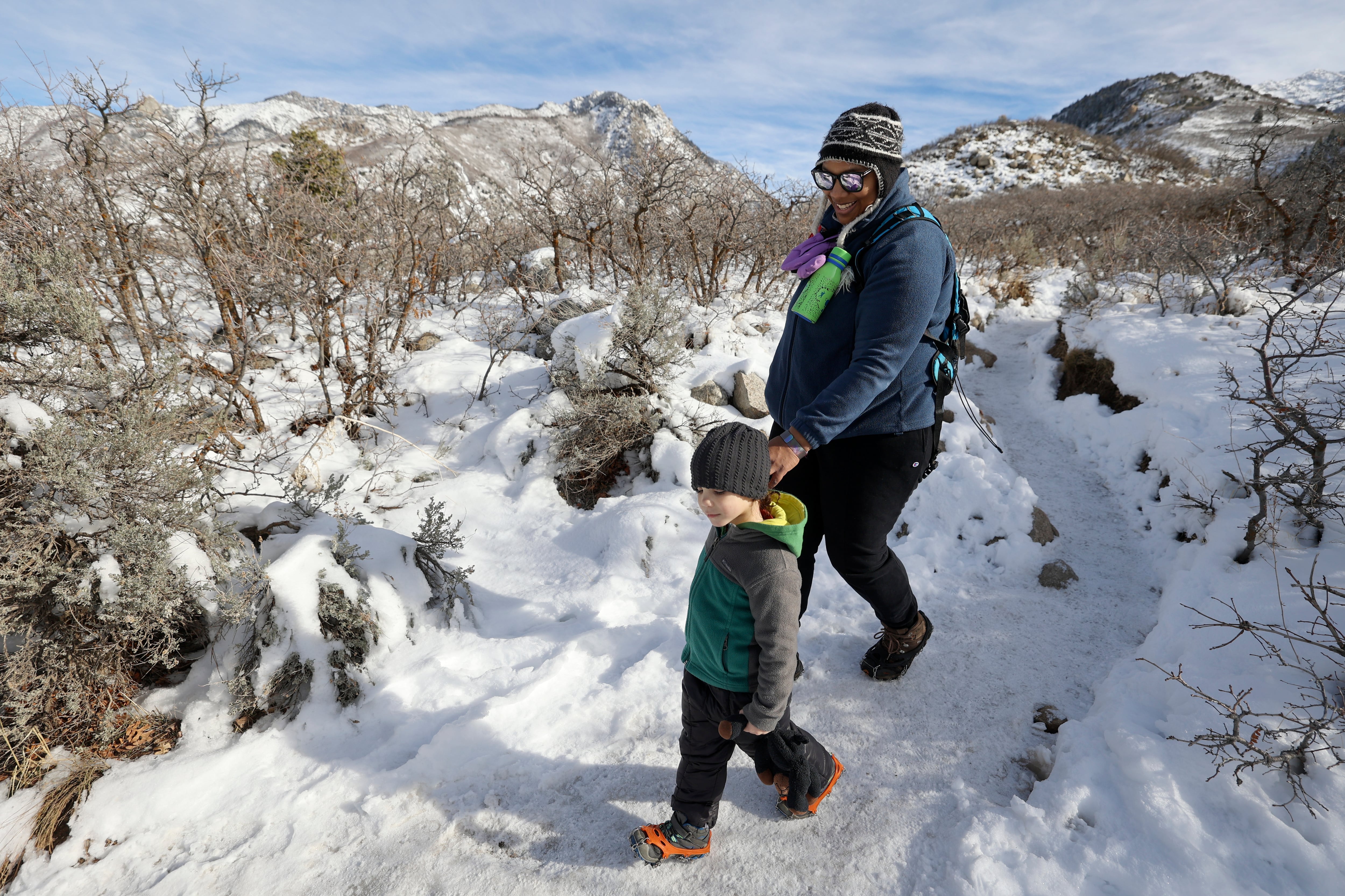 Khepri Dillin, 3, and Sarah Dillin hike on the Bell Canyon Trail near Sandy on Wednesday.