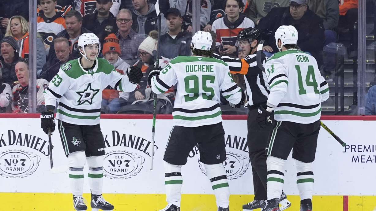 Dallas Stars' Wyatt Johnston (53), Matt Duchene (95) and Jamie Benn (14) celebrate after Johnston's goal during the second period of an NHL hockey game against the Philadelphia Flyers, Thursday, Jan. 9, 2025, in Philadelphia.
