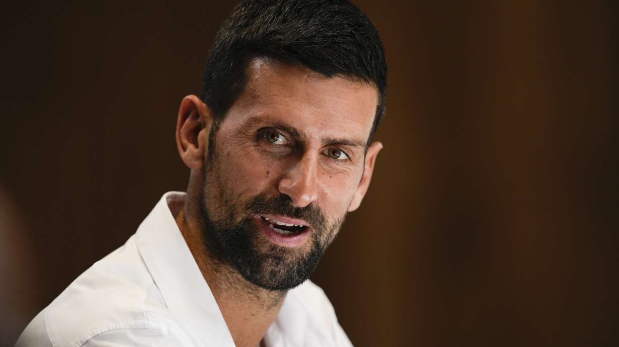 Serbia's Novak Djokovic reacts during a press conference ahead of the Australian Open tennis championship in Melbourne, Australia, Friday, Jan. 10, 2025.