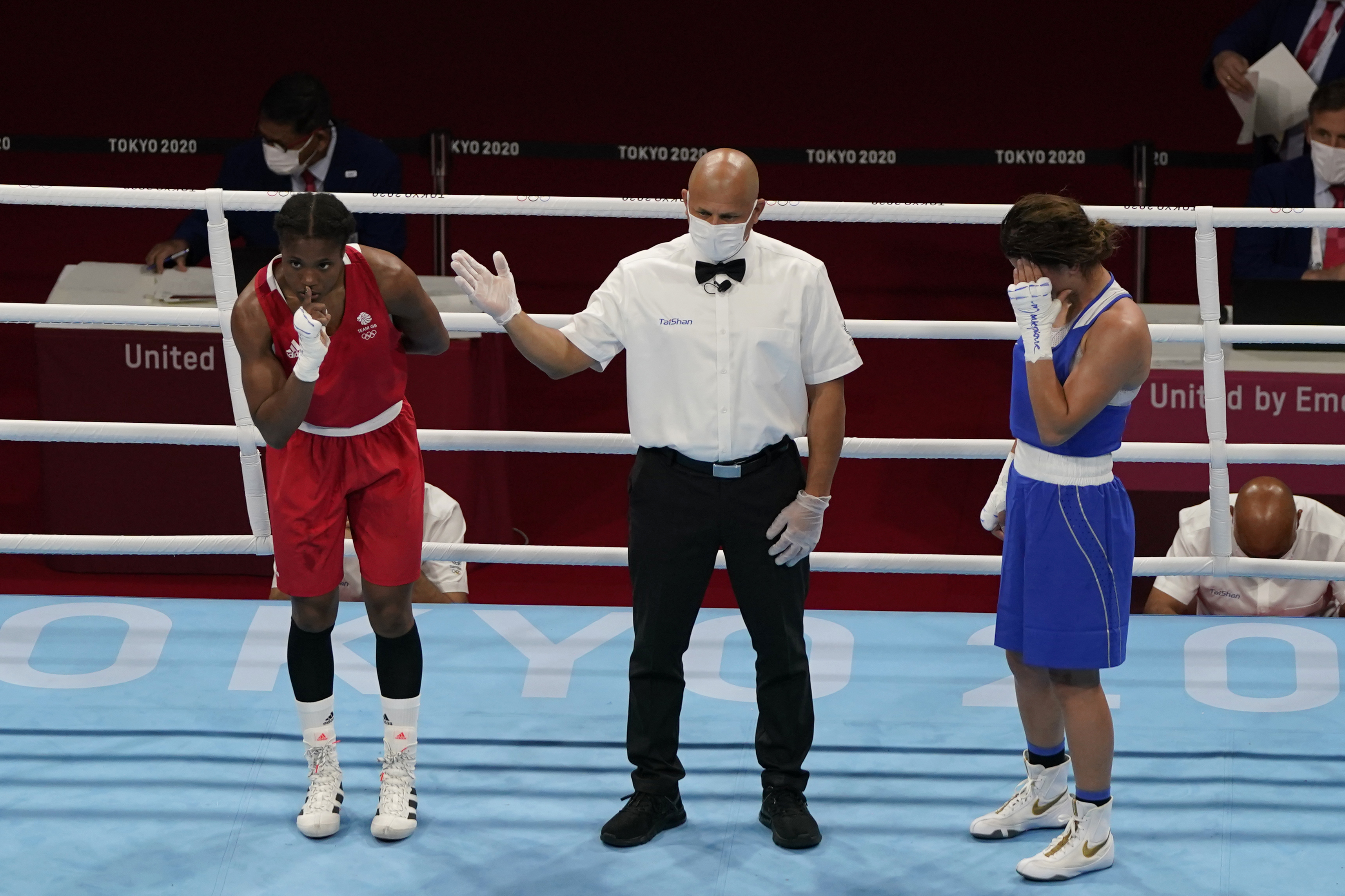 FILE -Caroline Dubois, of Great Britain, left, reacts after defeating Donjeta Sadiku, of Kosovo, right, in a light weight (60kg) preliminary boxing match at the 2020 Summer Olympics, July 27, 2021, in Tokyo, Japan. 