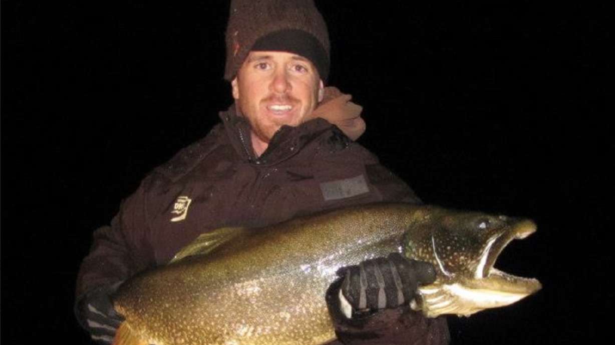 Riley Peck holds up a fish. As a former state wildlife biologist, Peck was named on Thursday as the next director of the Utah Division of Wildlife Resources.