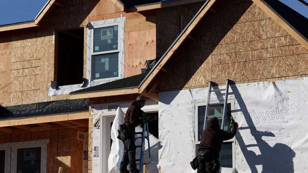 A home is constructed in Salt Lake City on Friday. In 2024, Utah’s home prices returned to near-record highs, even though they had dropped slightly in 2023. At the same time, mortgage rates stayed high, making it extremely difficult for new buyers to afford homes.