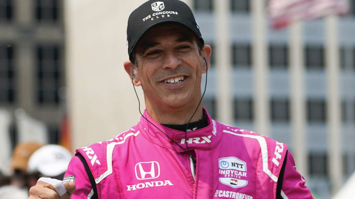 FILE - Helio Castroneves is introduced before the IndyCar Detroit Grand Prix auto race in Detroit, June 4, 2023.