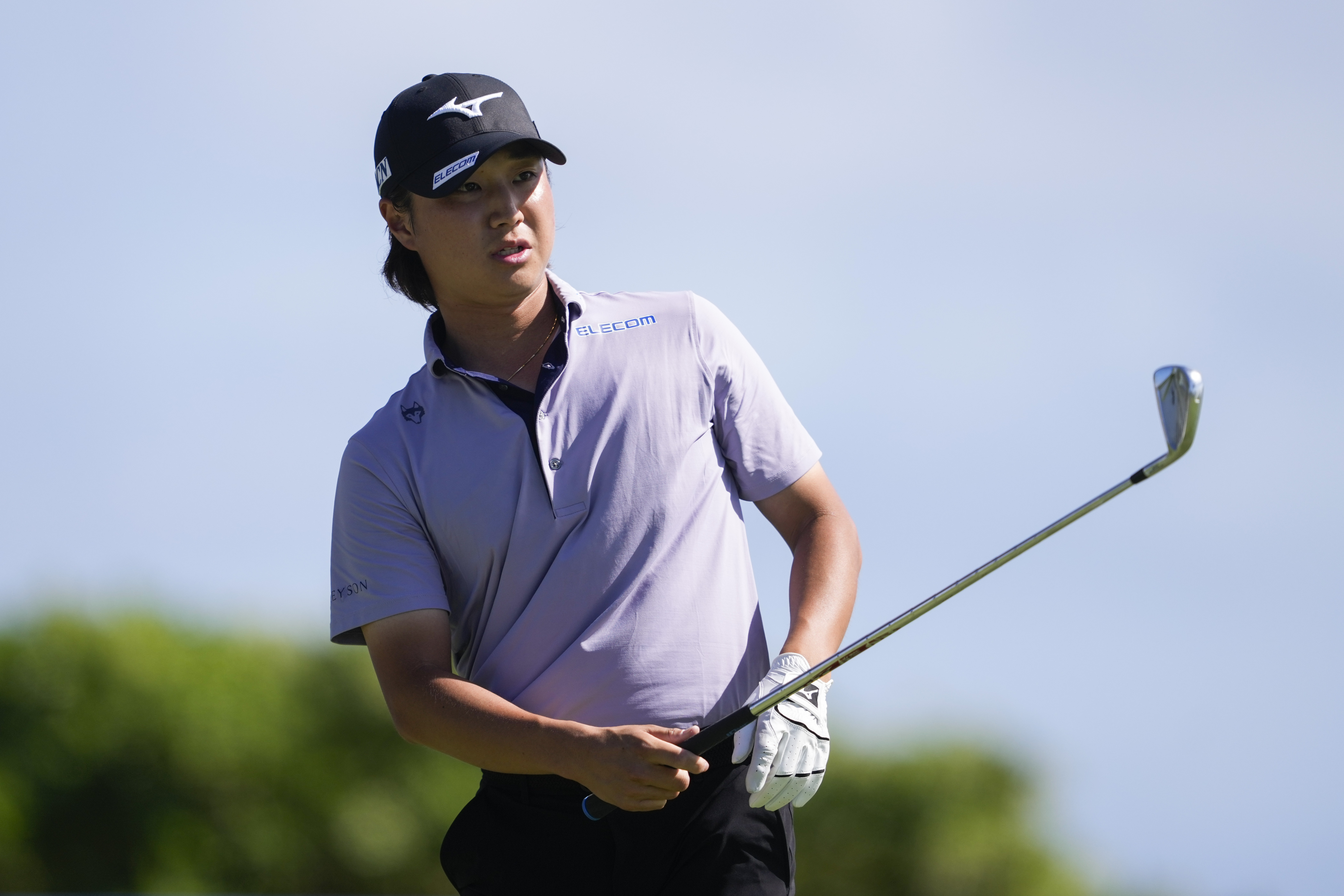 Kensei Hirata, of Japan, watches his shot on the 17th hole during the second round of the Sony Open golf event, Friday, Jan. 10, 2025, at Waialae Country Club in Honolulu.
