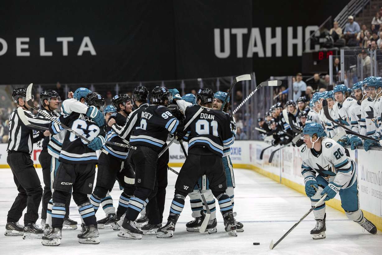 Utah Hockey Club players fight against San Jose Sharks players during the second period of an NHL hockey game Friday, Jan. 10, 2025, in Salt Lake City.