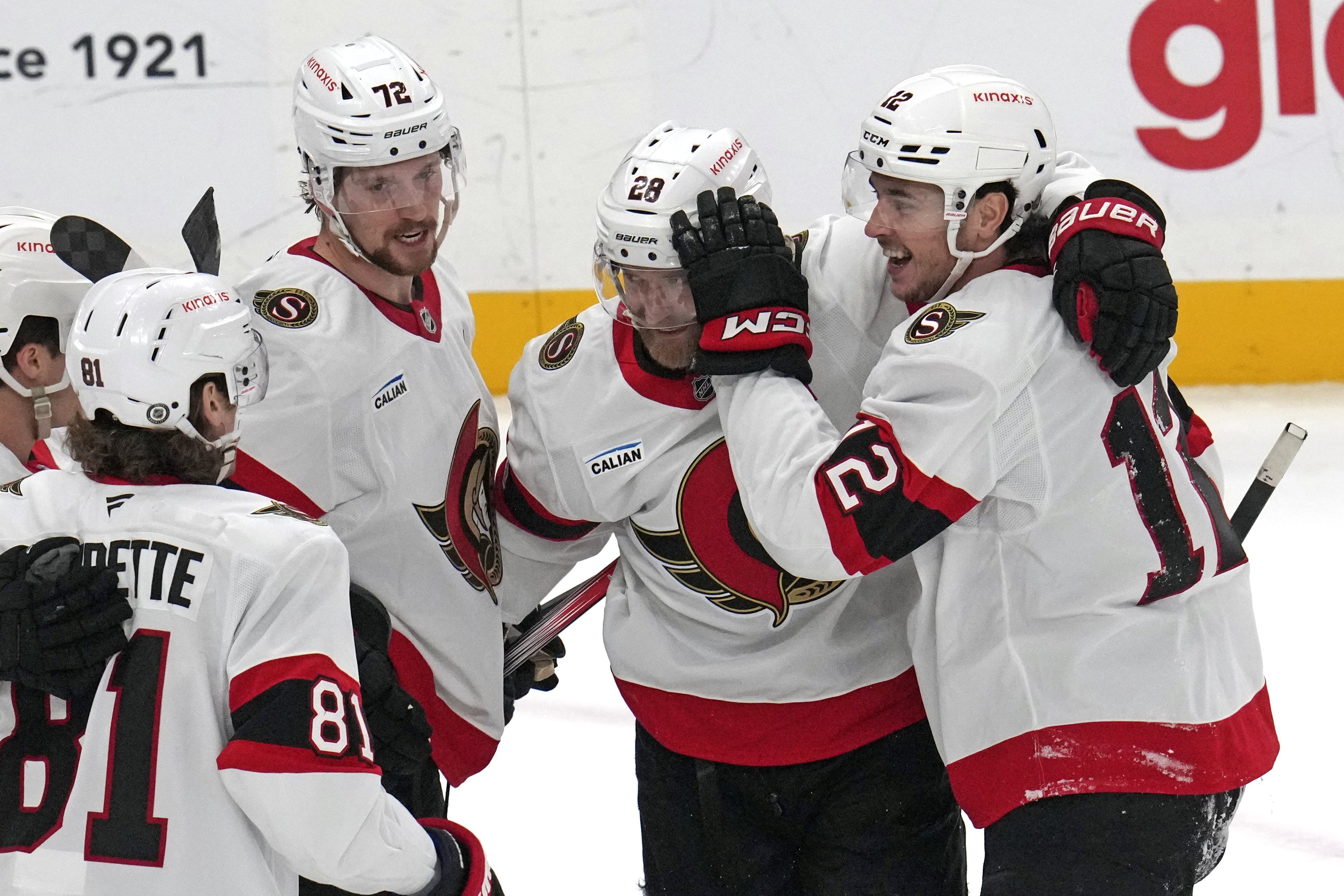 Ottawa Senators' Shane Pinto, right, celebrates his first of two goals during the first period of an NHL hockey game against the Pittsburgh Penguins in Pittsburgh, Saturday, Jan. 11, 2025.